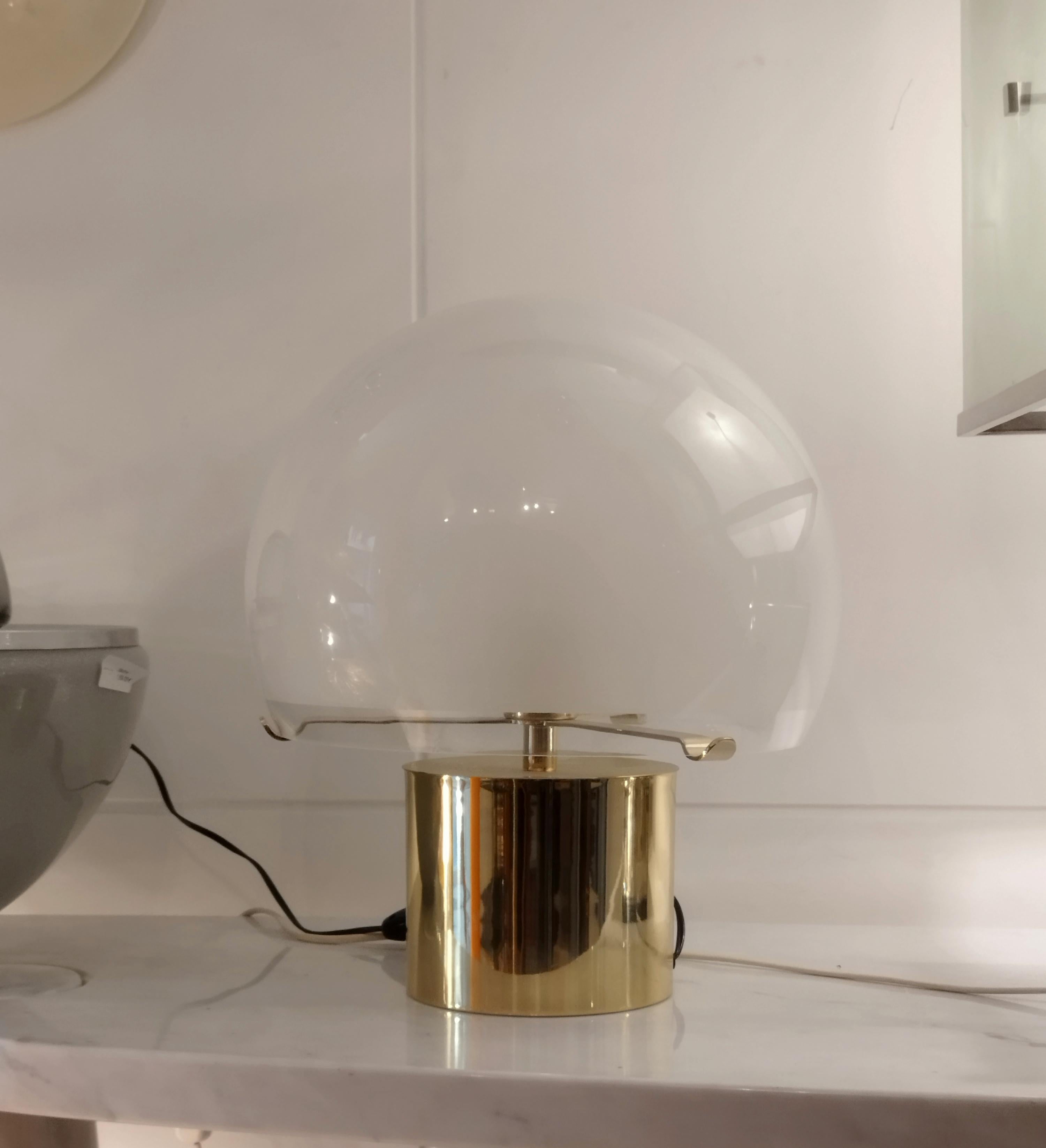 Porcino' modern table lamp in brass and frosted glass. By Luigi Caccia Dominioni, Italy, 1966.
This spherical lamp was designed by Luigi Caccia Dominioni for Azucena. The design is reminiscent of the Space Age style of the mid to late 1960s. The