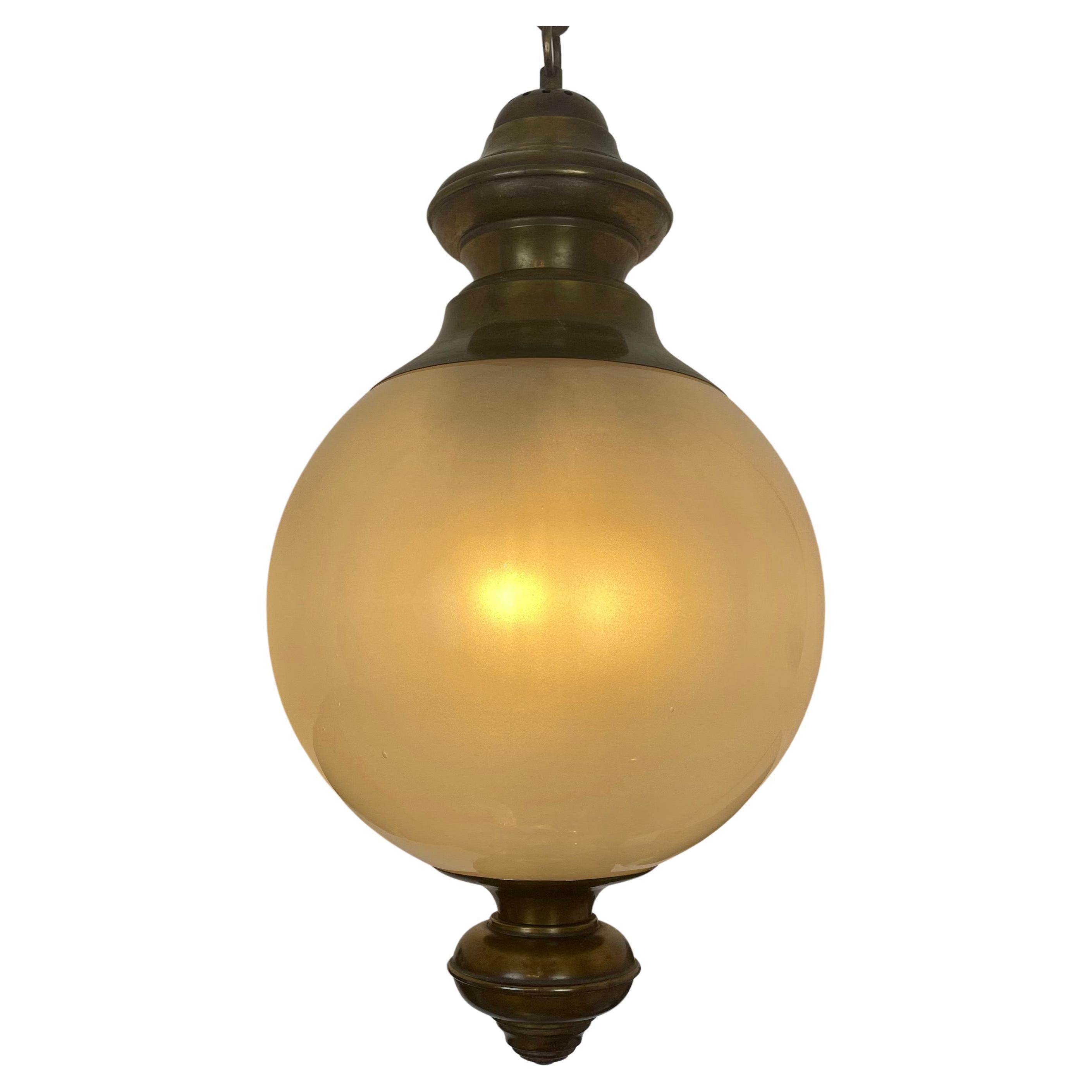 Luigi Caccia Dominioni (Milan 1913-2016) Chandelier for Azucena circa 1960, a circular brass mount and a sphere of Murano hand blown opalescent, frosted glass  Italian pendant. .Good condition, no cracks, working with three E14 lights inside the