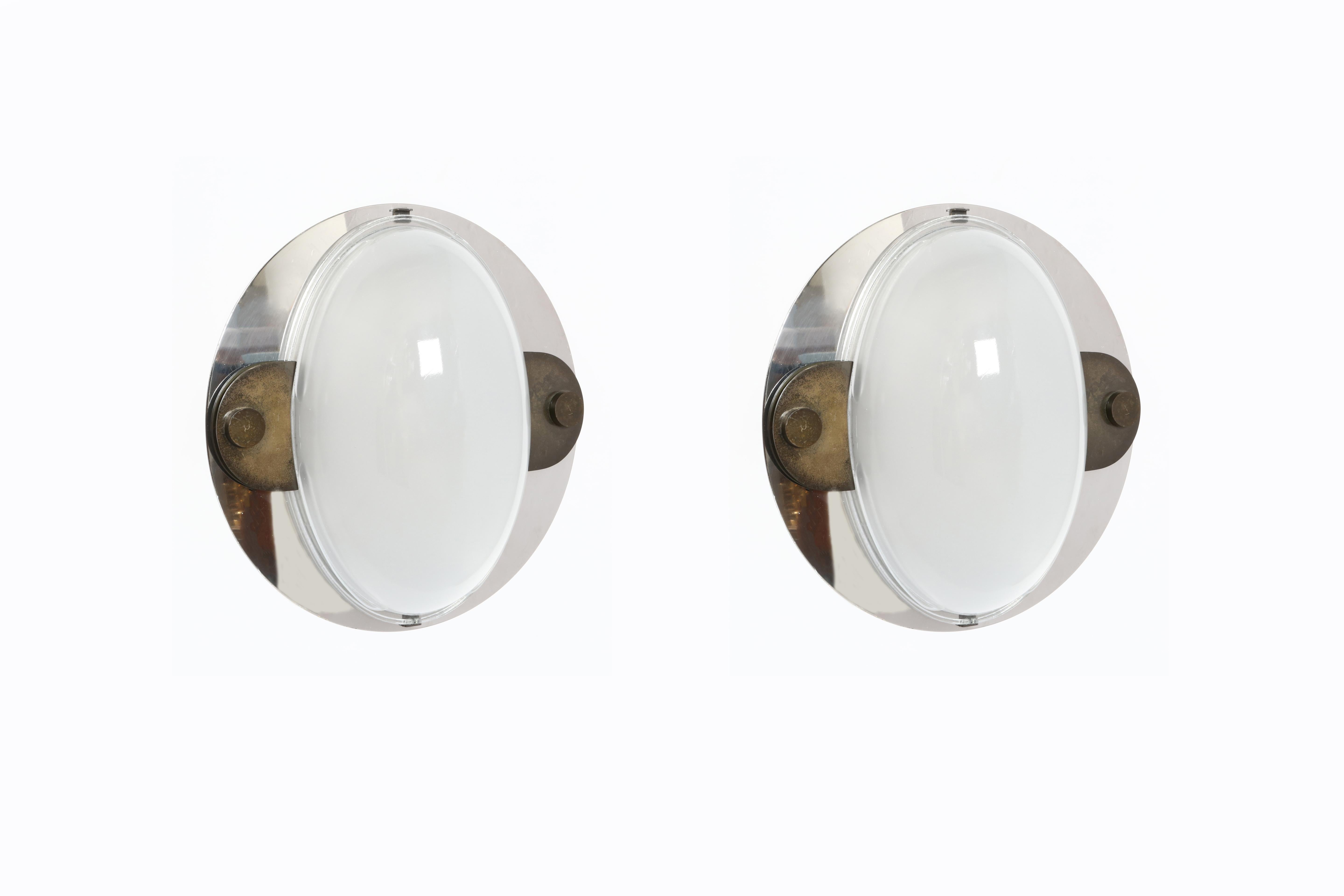 Luigi Caccia Dominioni for Azucena wall flush mount light.
Model LSP12.
Designed and manufactured in Italy, 1970s
Rare and impressive.
Glass, chrome plated metal and patinated brass.
Chrome 18 inch round disk, oval glass shade.
Two medium base