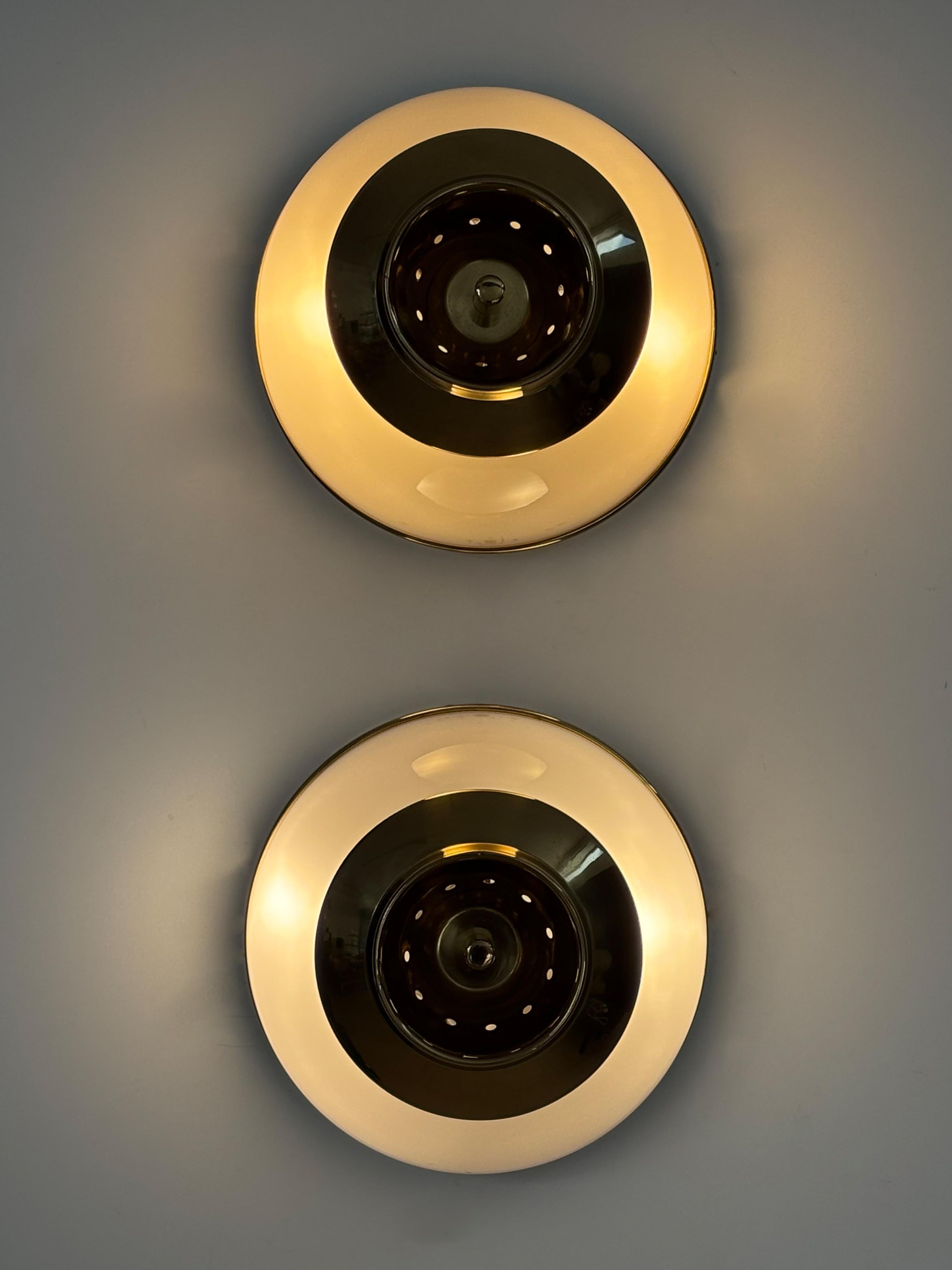 Italian midcentury modern design set of two sconces wall lamps or ceiling lamps “Mezzo Pallone” model, large version, designed by Luigi Caccia Dominioni (Milan 1913 - Milan 2016 ) and produced by Azucena with brass frame and details and half globe