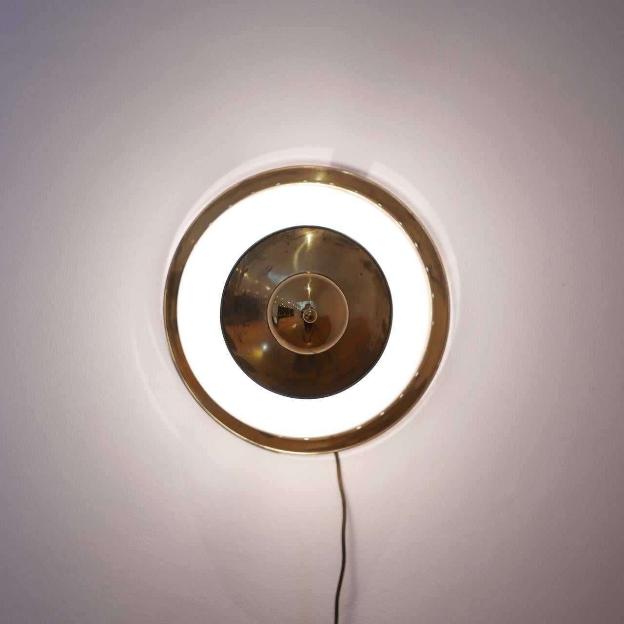 A rare wall or ceiling light attributed to renowned designer, the Italian Luigi Caccia Dominioni,

circa 1960s, Italian, likely by Azucena.

Re-wired professional and PAT tested.

Priced and Sold Individually.
  