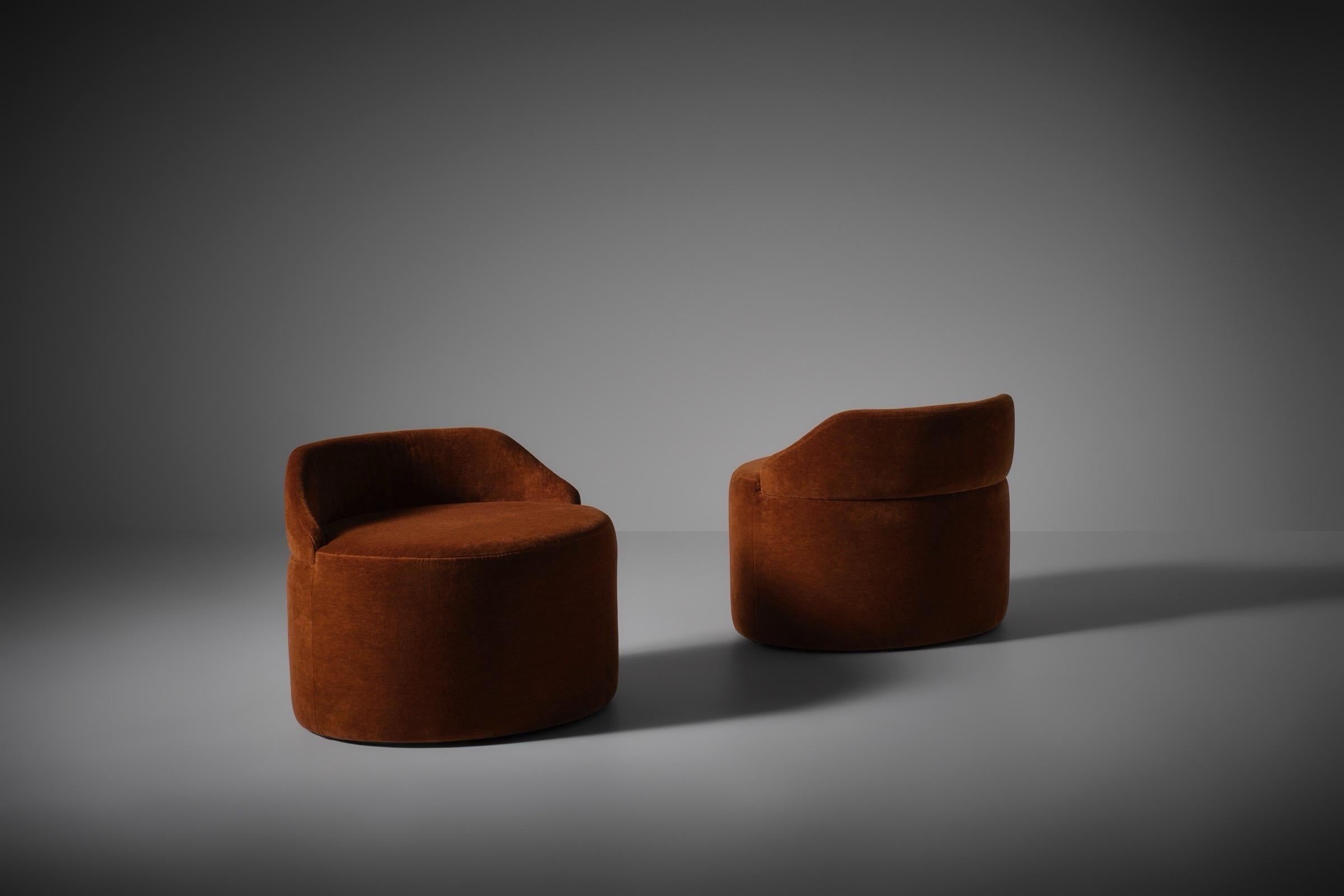 Rare low stools by Luigi Caccia Dominioni for Azucena, Italy ca. 1960. Elegant design with typical Dominioni lines, created out of an oval base and arch shaped backrests. The stools are upholstered in a beautiful warm burnt orange velvet.