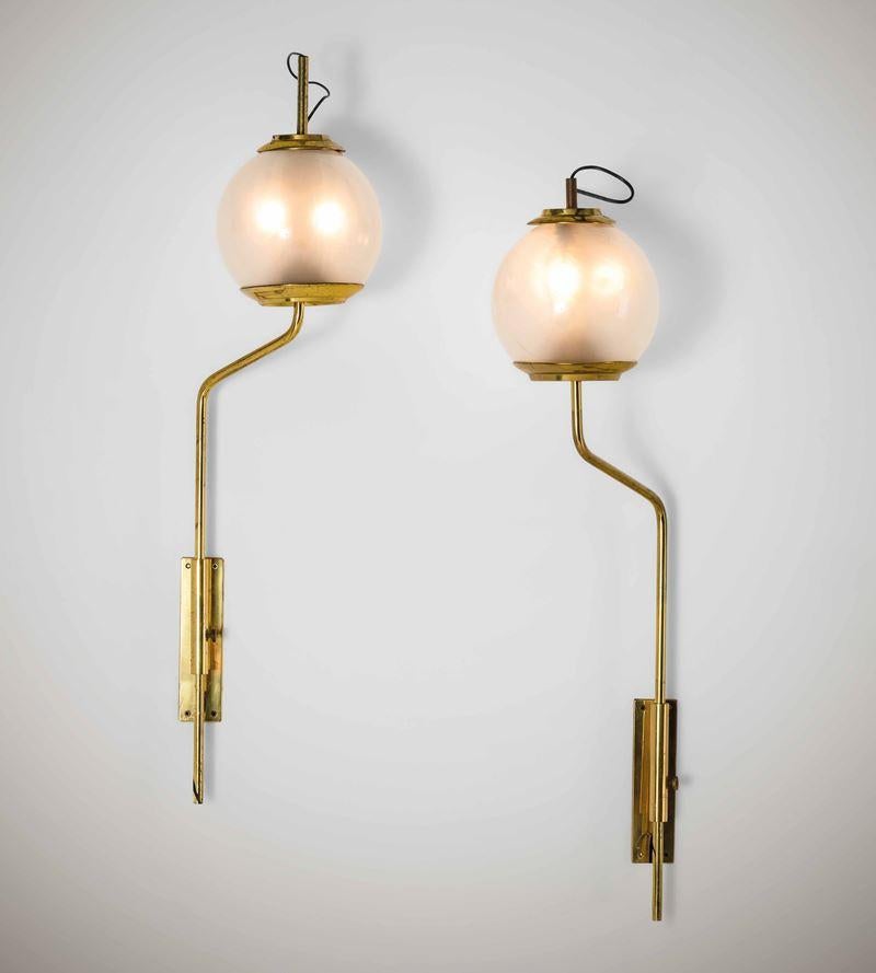 Elegant original pair of Luigi Caccia Dominioni LP11/Pallone adjustable Wall Lamps, made by Azucena, Italy, in the 1958. 
Brass frame and opaline glass shade. 
It is possible to rotate it and adjust the height. Pair of wall lights mod. LP11 by
