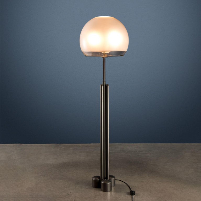 Floor lamp with extendable stem; enamelled metal, satin glass diffuser.