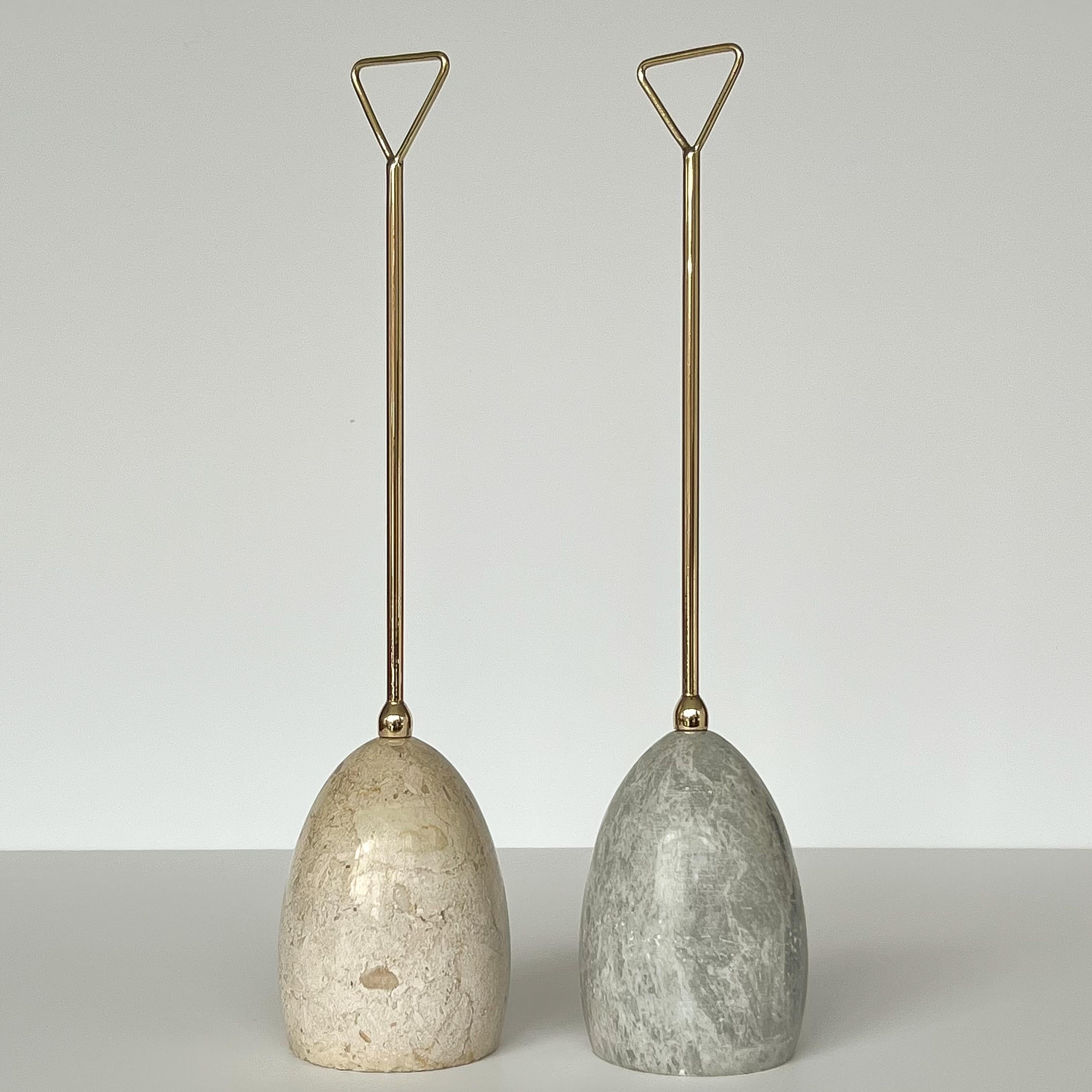 Luigi Caccia Dominioni (1913-2016) marble and brass handled doorstops for Azucena, Italy circa 1950s. Priced individually. Egg shaped marble weighted bases with polished solid brass handles. Bases measure 5.75