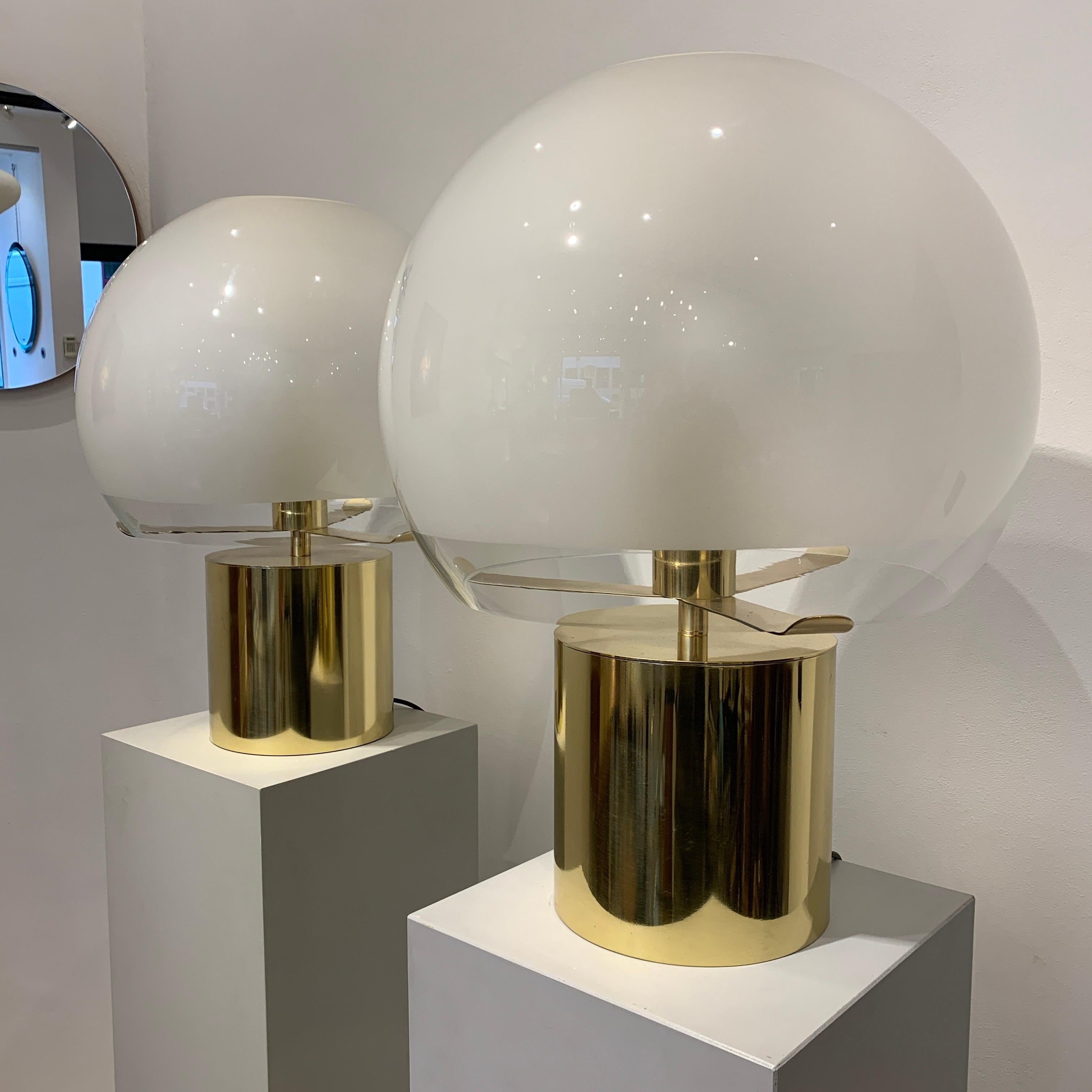 The Porcino lamp was created in 1967 by Luigi Caccia Dominioni and edited by Azucena. The present pair is in brass with their original glass diffusers. There are three lamps under the diffuser and one at the top. Please note that the lamps are in