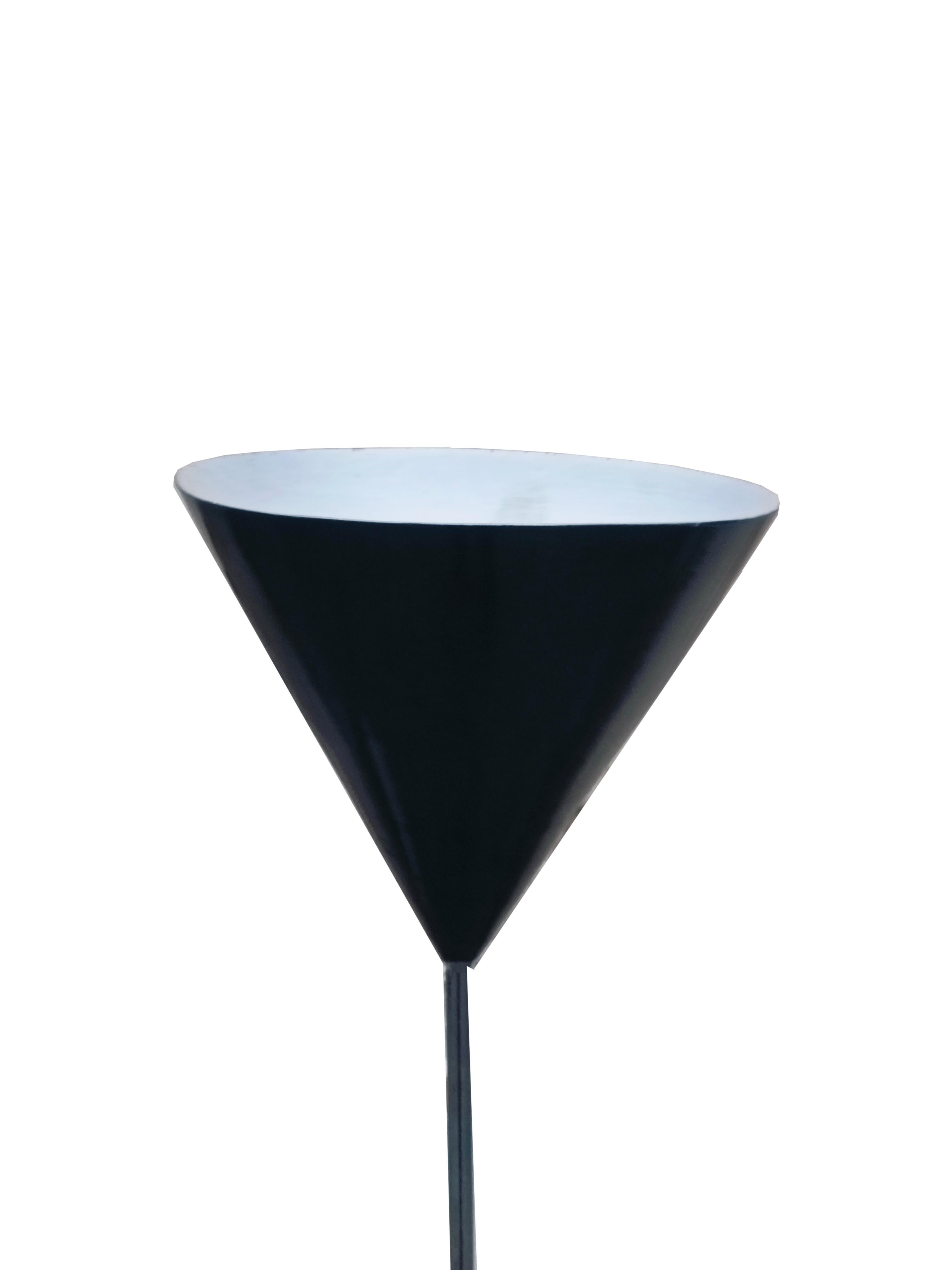The Imbuto Lamp by Luigi Caccia Dominioni for Azucena stands out for its unique and minimalist design, featuring a refined steel stem that lends a touch of sophistication and luxury. Made with fine materials and impeccable workmanship, this lamp is