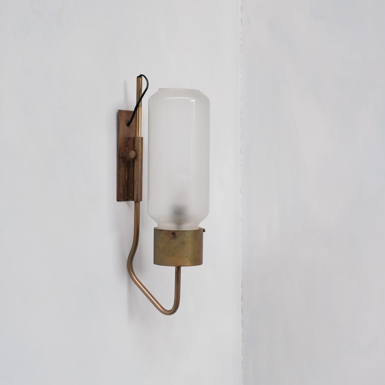 A rare wall light by Luigi Caccia Dominioni. 

'Bidone' LP10 Model. 

Italy, c1960s. 

Can be hung either way. 

Remains in good condition with great patina. 

The light could be polished to taste. 

Since re-wired and PAT tested.
