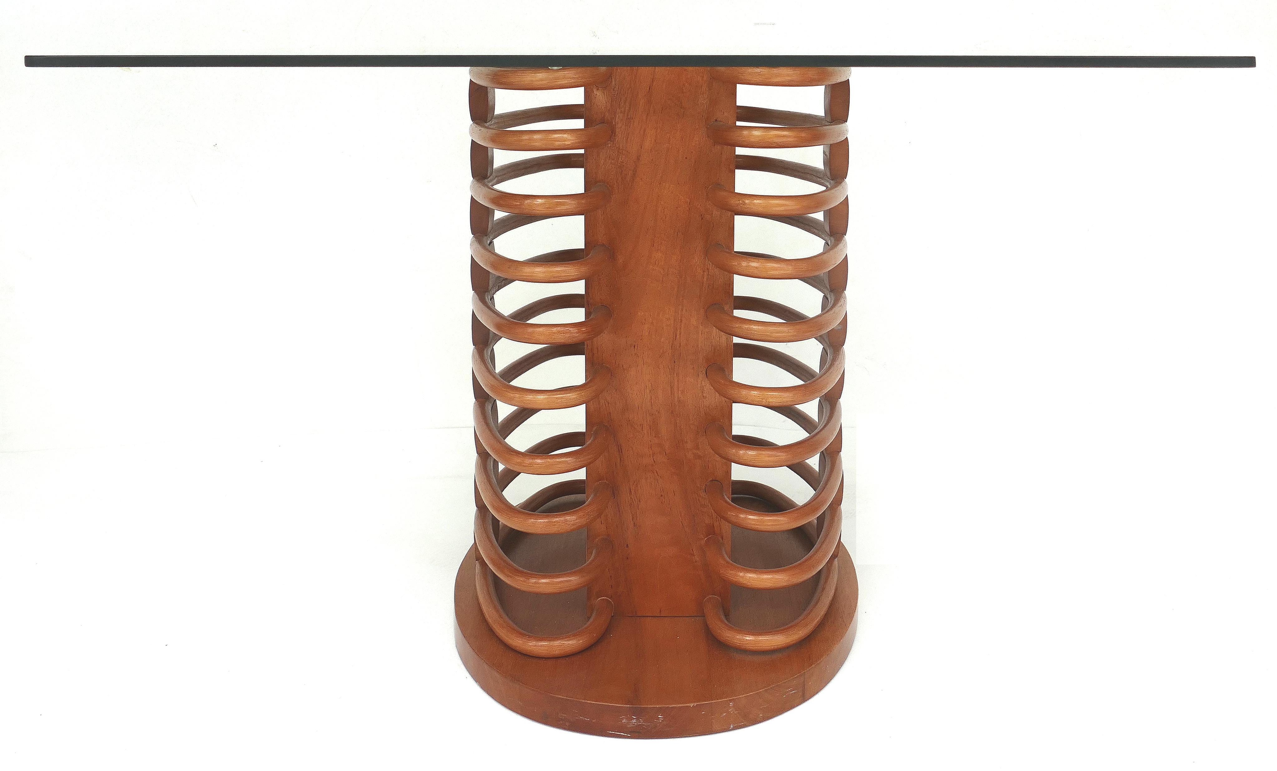 Luigi Colani for Aida rattan dining table and chairs 

Offered for sale is a rattan dining table and four chairs designed by Luigi Colani and manufactured by Aida Rattan of Indonesia. The four chairs have Ultra suede pad seats and the table has a