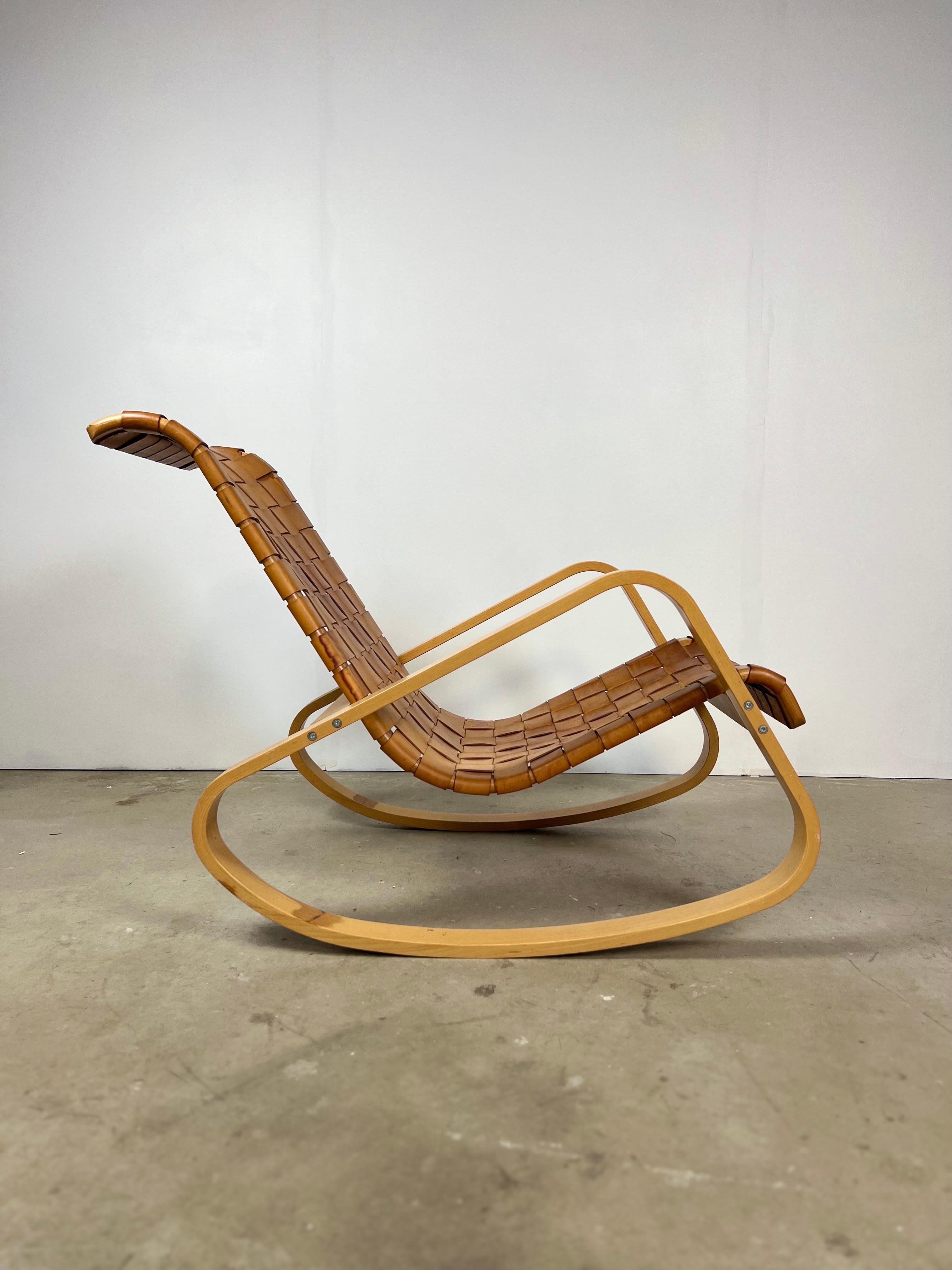 Mid-century 1970s Italian bentwood and leather rocking chair designed by Luigi Crassevig. Leather shows natural patina, some discoloration to the bottom interior of the frame.