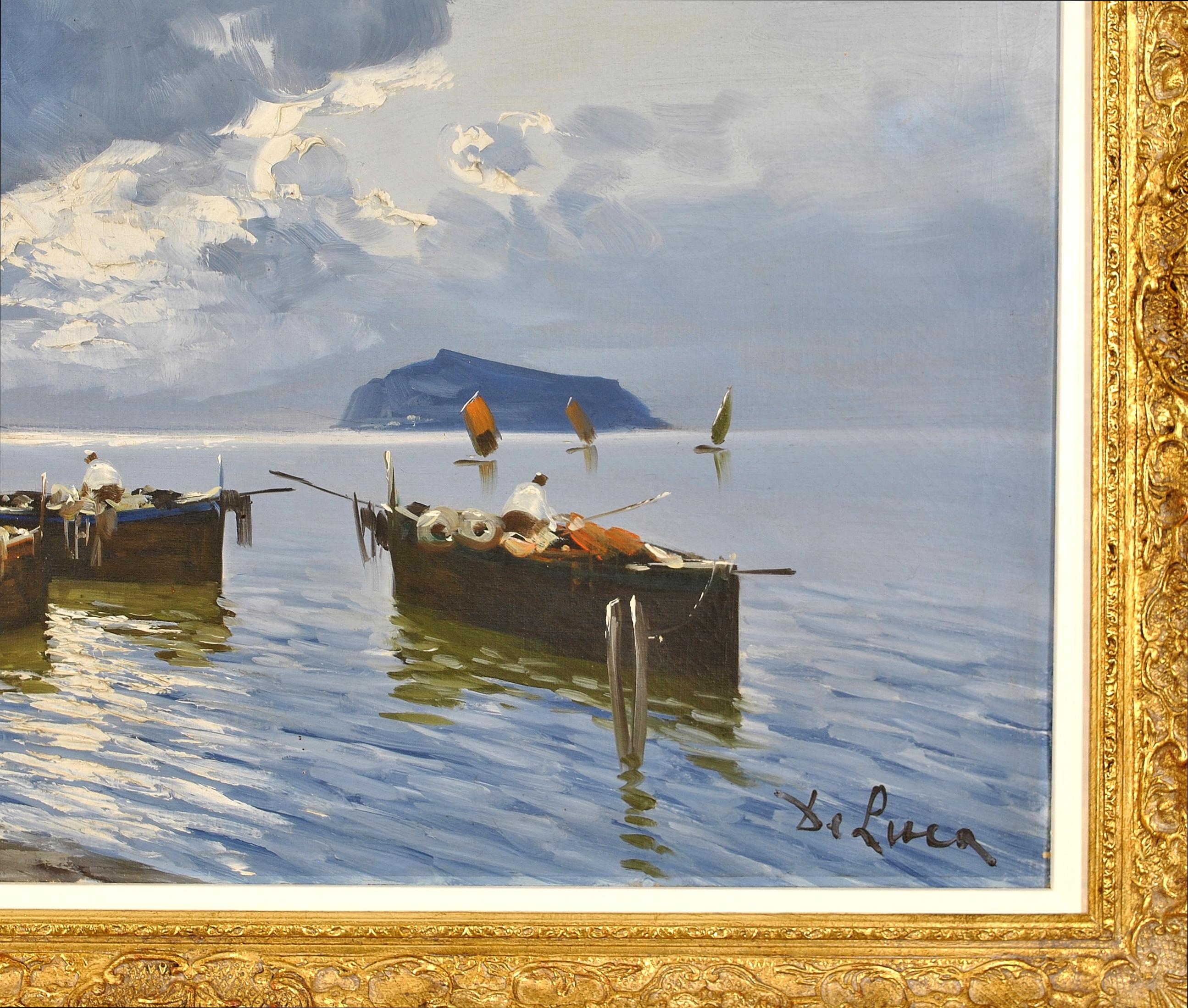 This beautiful 1930's Italian impressionist oil on canvas by Luigi De Luca depicts fishermen on the Bay of Naples at dusk, with Capri beyond.

The work is signed lower right and presented in a swept gilt frame.

Artist: Luigi De Luca (Italian, 20th
