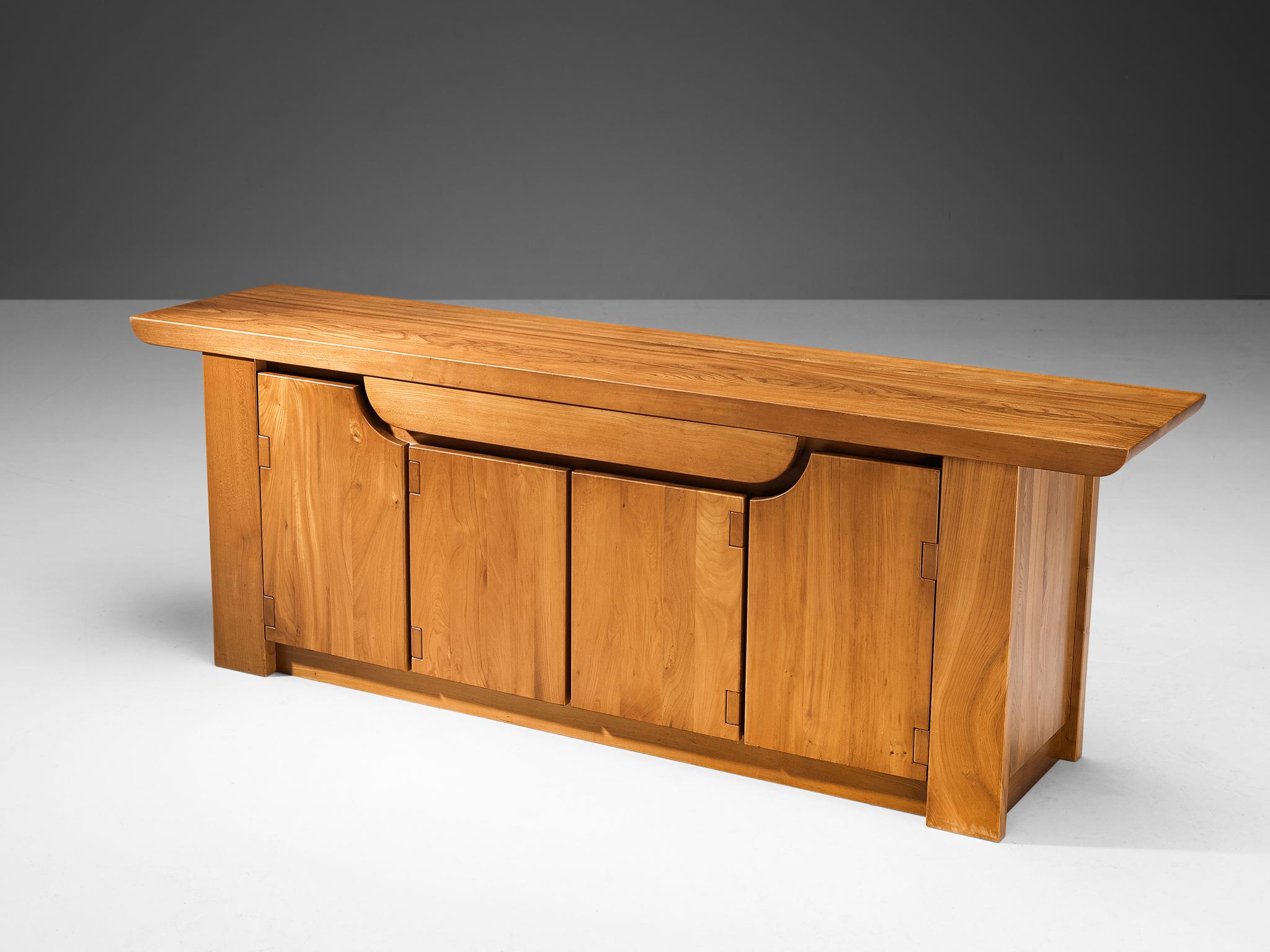 Luigi Gorgoni for Roche Bobois, sideboard, solid elm, France, 1980s

The Italian designer and architect Luigi Gorgoni designed furniture pieces for Roche Bobois since the mid 1970s. Gorgoni is known for its streamlined and clear designs, this piece