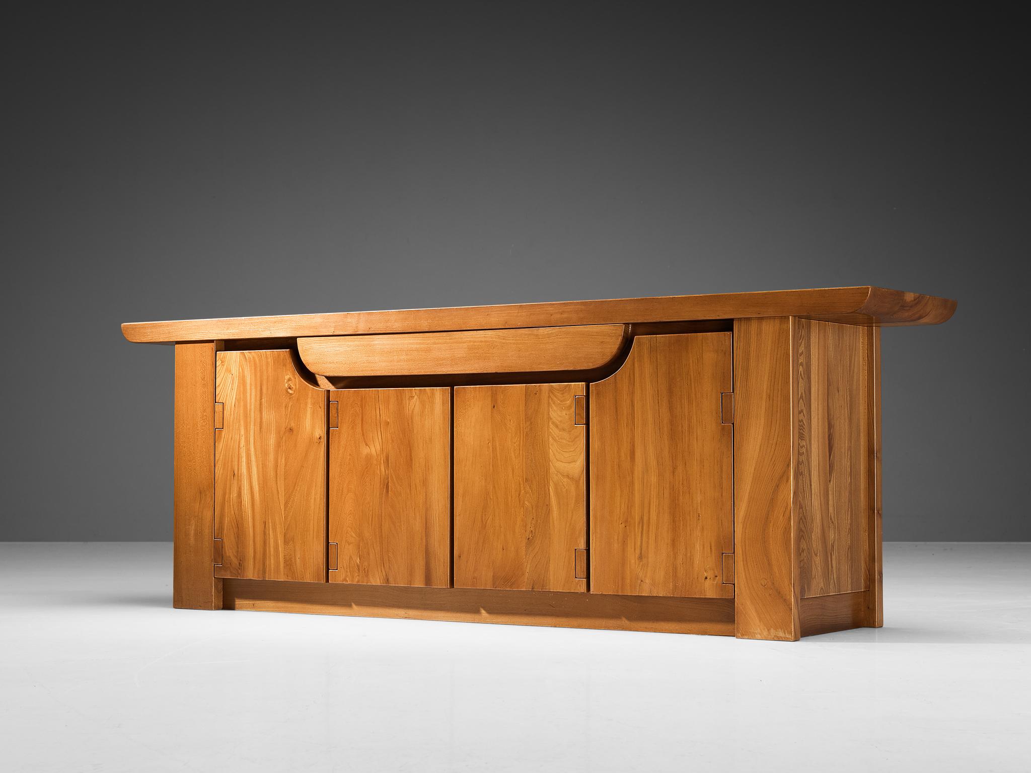 Luigi Gorgoni for Roche Bobois, sideboard, solid elm, France, 1980s

The Italian designer and architect Luigi Gorgoni designed furniture pieces for Roche Bobois since the mid 1970s. Gorgoni is known for its streamlined and clear designs, this piece