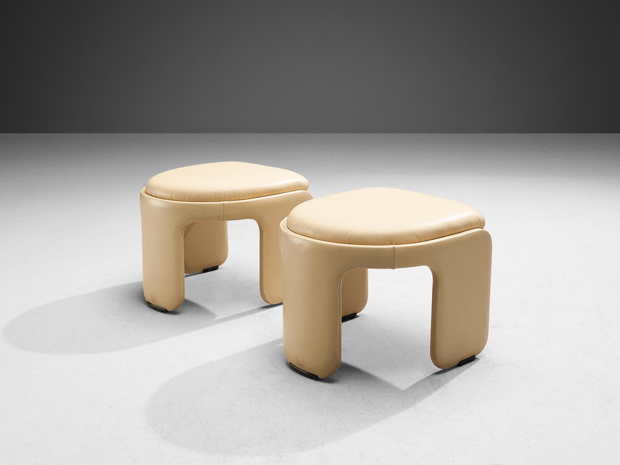 Luigi Massoni for Poltrona Frau, ottomans, model 'Dinette', leather, chromed steel, Italy, 1980s. 

This rare pair of ottomans epitomizes a splendid construction based on characteristic shapes and executed in a soft off-white leather. Therefore,