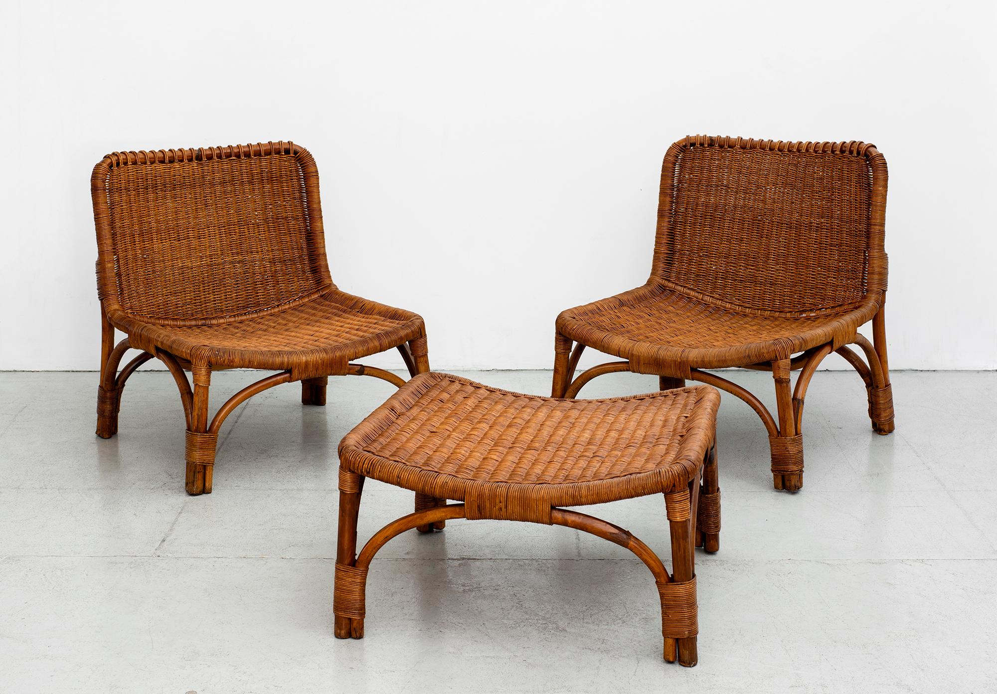 Pair of Italian lounge chairs and ottoman by Luigi Massoni - Manufactured by Fratelli Castano, circa 1960. 
Wonderful shape and patina to wicker. 

Ottoman 
W 25 1/2”
D 25 1/2”
H 13 1/2”.