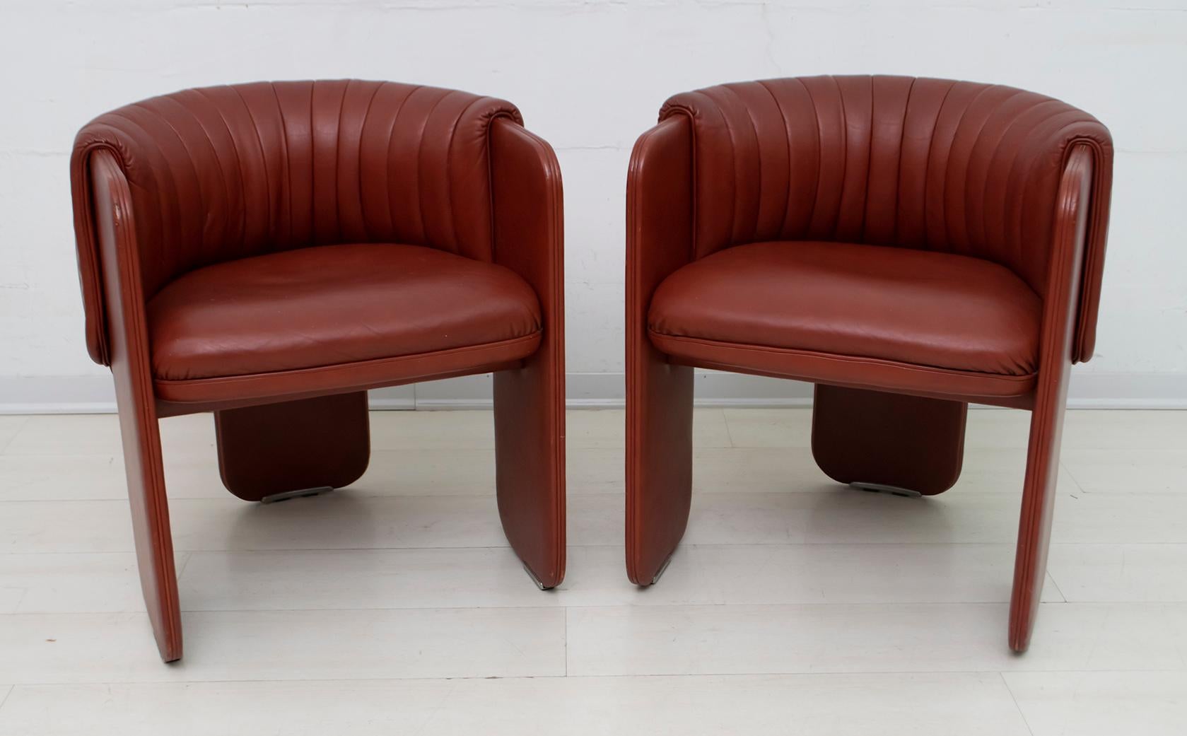 Luigi Massoni for Poltrona Frau. Two Dinette model cockpit armchairs entirely upholstered in leather, 1980s. Very rare!

