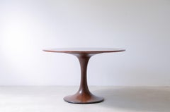 Luigi Massoni. Rare elegant table with turned and veneered base.