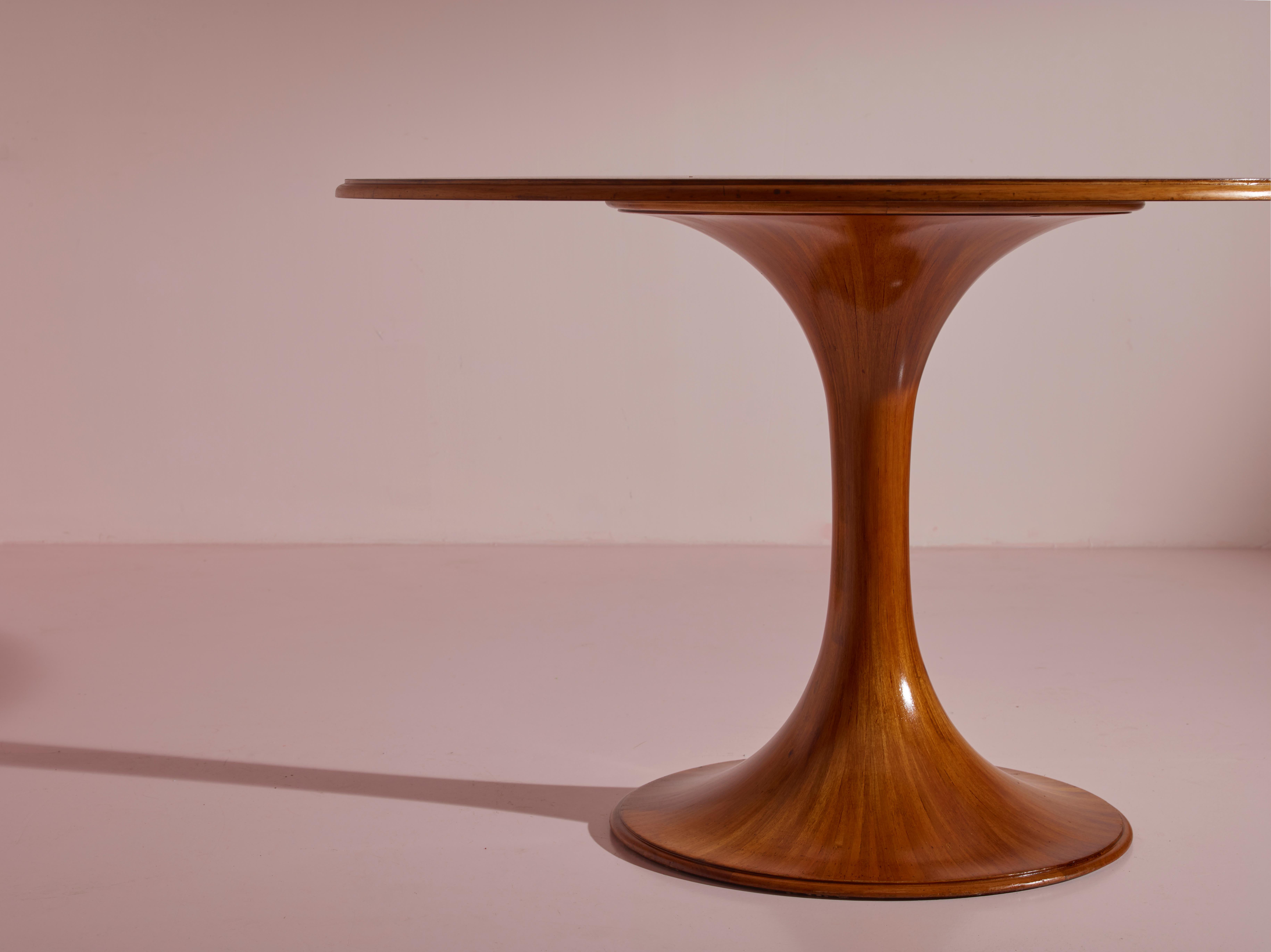 Mid-20th Century Luigi Massoni walnut Clessidra round dining table by Mobilia, Italy, 1960s