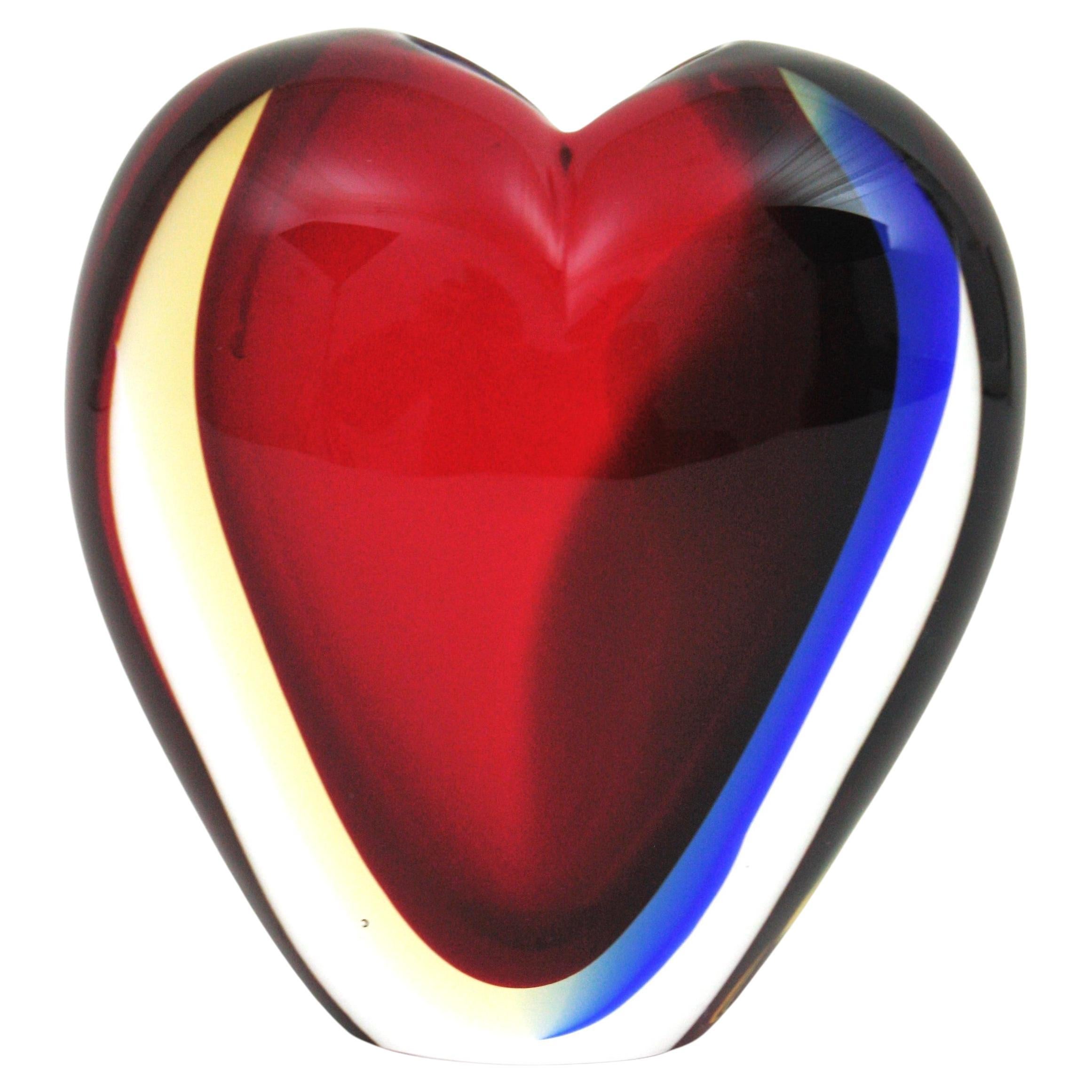 Signed Murano Art Glass Heart Shaped Sommerso Vase, Luigi Onesto for Vetreria Artistica Oball, Italy, 1960s.
Eye-catching colorful sommerso glass heart vase with small heart shaped opening on top.  
Beautifully created in a combination of red glass