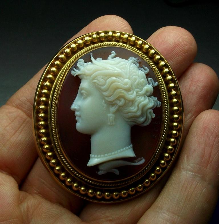 Magnificent Museum Quality hard stone cameo brooch depicting the Nymph Arethusa. A rare subject in a cameo and rare to find so wonderfully carved and signed. This cameo is probably after a coin depicting Arethusa found in Sicily, Italy, look at the