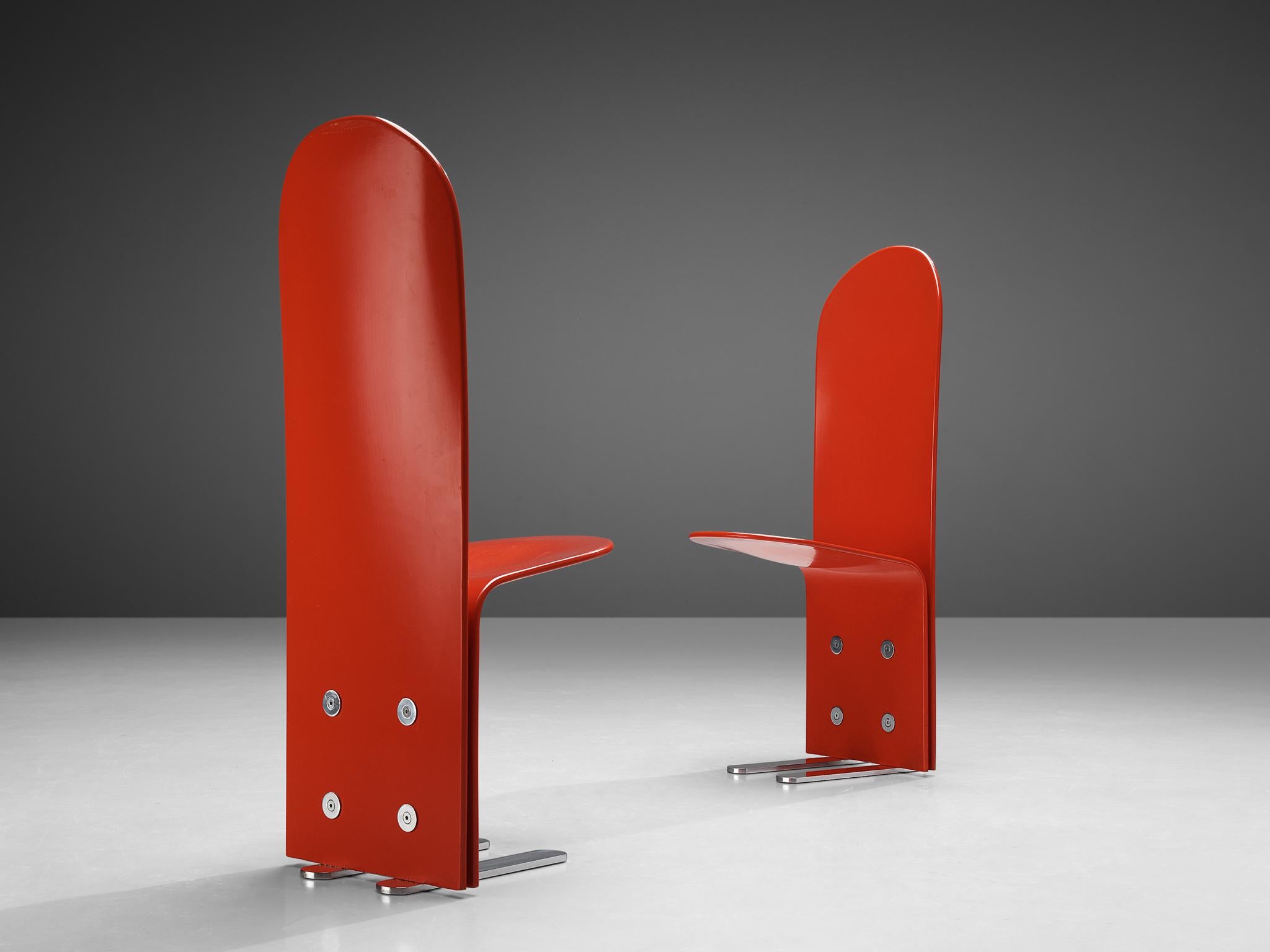 Luigi Saccardo for Arrmet, dining chairs, model 'Pelicano', lacquered plywood, chrome-plated metal, 1970s

Eccentric chairs executed in red lacquered plywood. The remarkable high back give these chairs a stately appearance. Its simplistic frame