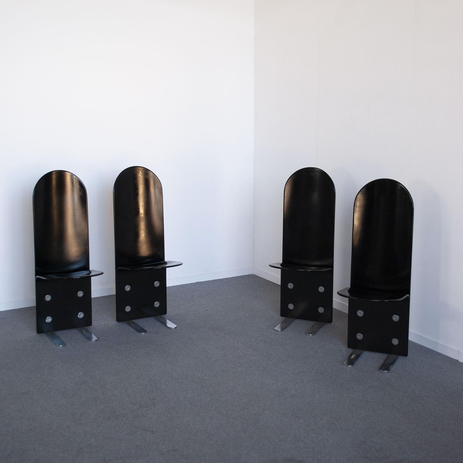 Set of four chairs model Pellicano in black lacquered curved wood feet in chromed steel with screws and washers for fixing the wood, designer Luigi Saccardo for Armet mid-70s.