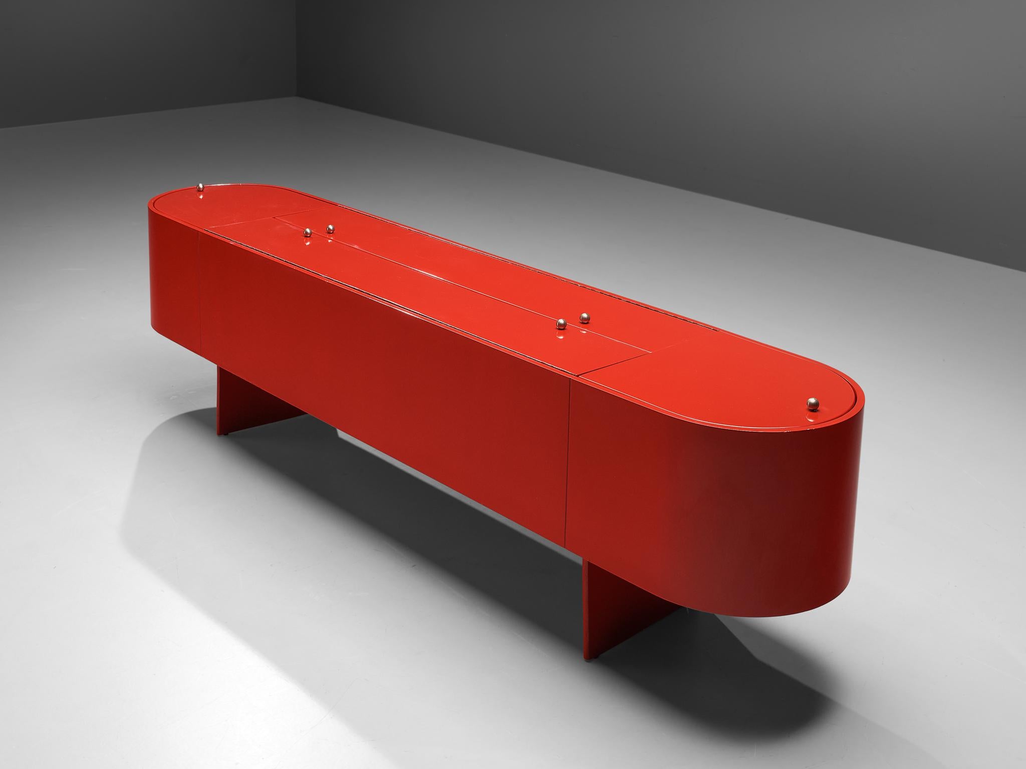 Luigi Saccardo for Arrmat, sideboard with dry bar Model ‘Parentisi’, red lacquered wood, metal, glass, Italy, 1976

The ‘Parentisi’ sideboard with dry bar by Italian designer Luigi Saccardo has two rare features. First, the format is the item is