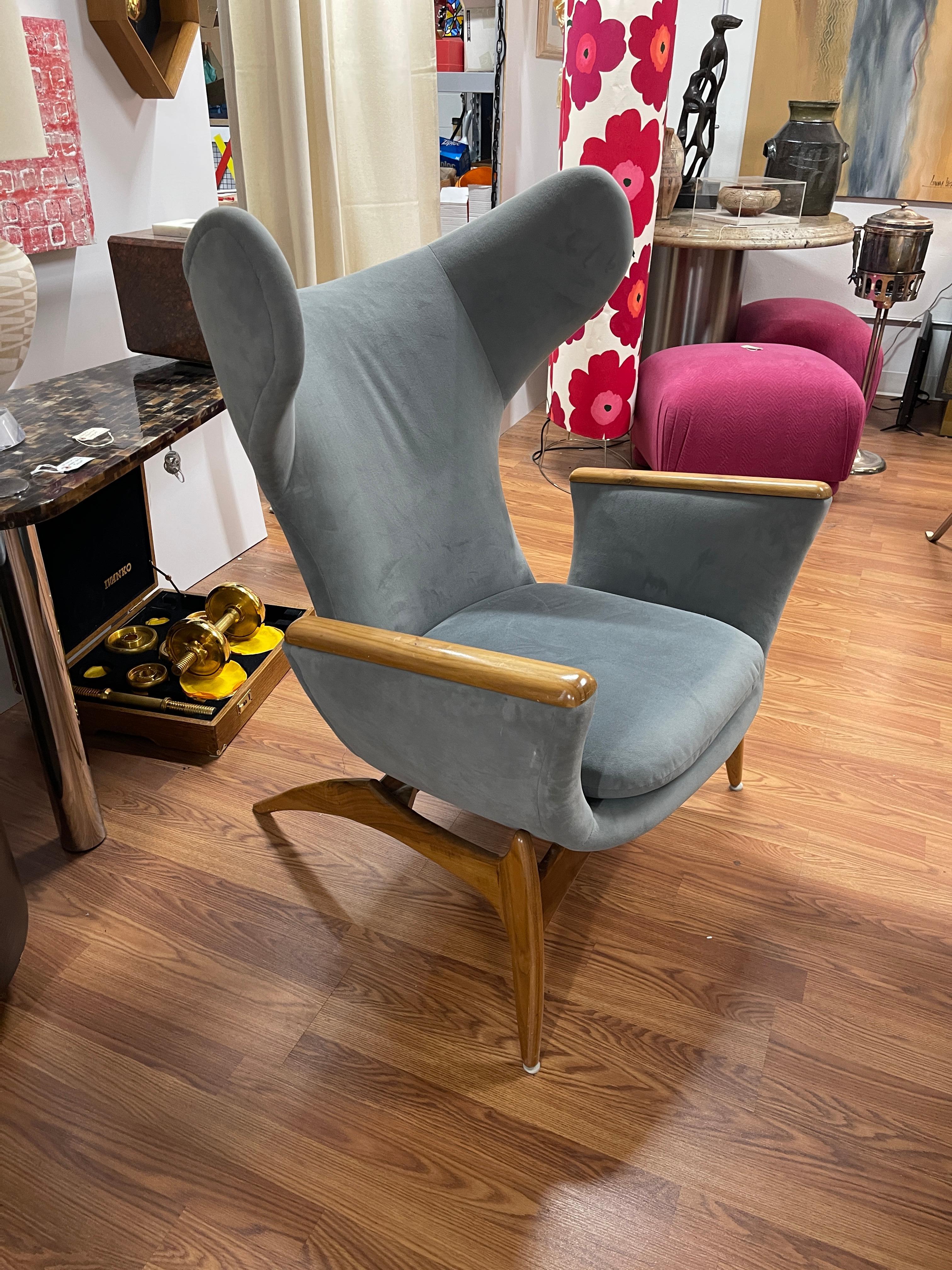 Beautiful sculptural Mid-Century Modern wingback lounge chair. Designed by Luigi Tiengo for Cimon. Vintage 960's chair that has been re-upholstered and reinforced on the underside. The wood has been refinished.