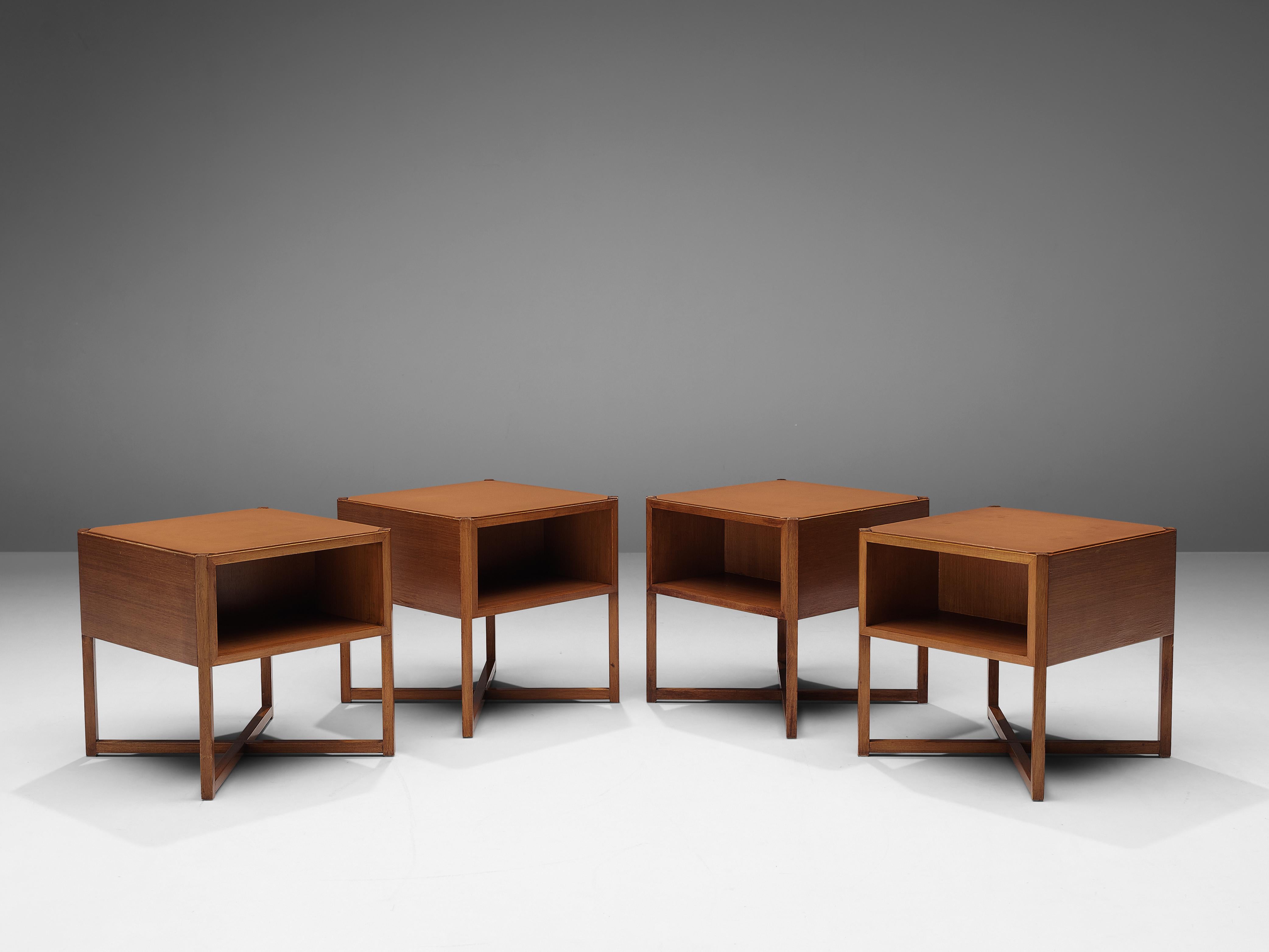 Luigi Vaghi for Alfredo Borghi Cantù, modular coffee tables, walnut, leather, Italy, 1960s

This set of modular coffee tables was designed by the Italian Luigi Vaghi for Alfredo Borghi Cantù. The tables are playful in their character, creating an