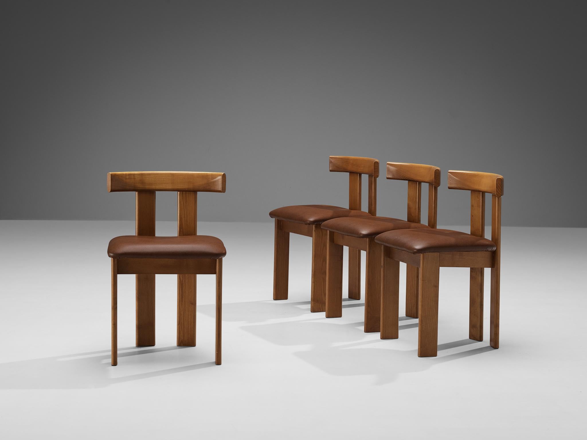 Luigi Vaghi for Former, set of four dining chairs, stained ash, faux leather, Italy, 1960s. 

A characteristic 'T-chair' design; simplistic yet very strong in lines and proportions. Wonderful dynamic frame executed in ash, whereby the rear legs are