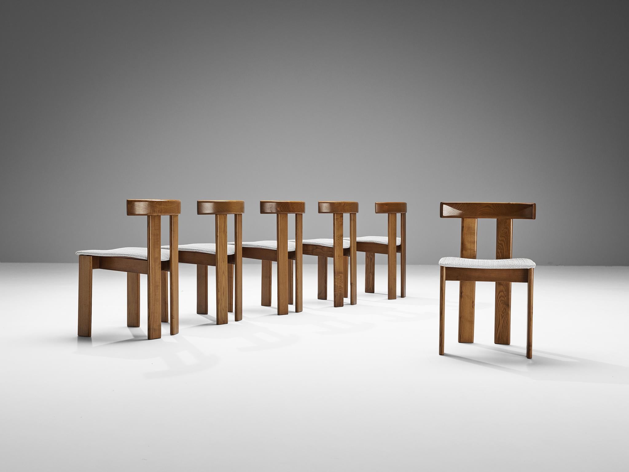 Luigi Vaghi for Former, set of six dining chairs, stained ash, white fabric, Italy, 1960s. 

A characteristic 'T-chair' design; simplistic yet very strong in lines and proportions. Wonderful dynamic frame executed in ash, whereby the rear legs are