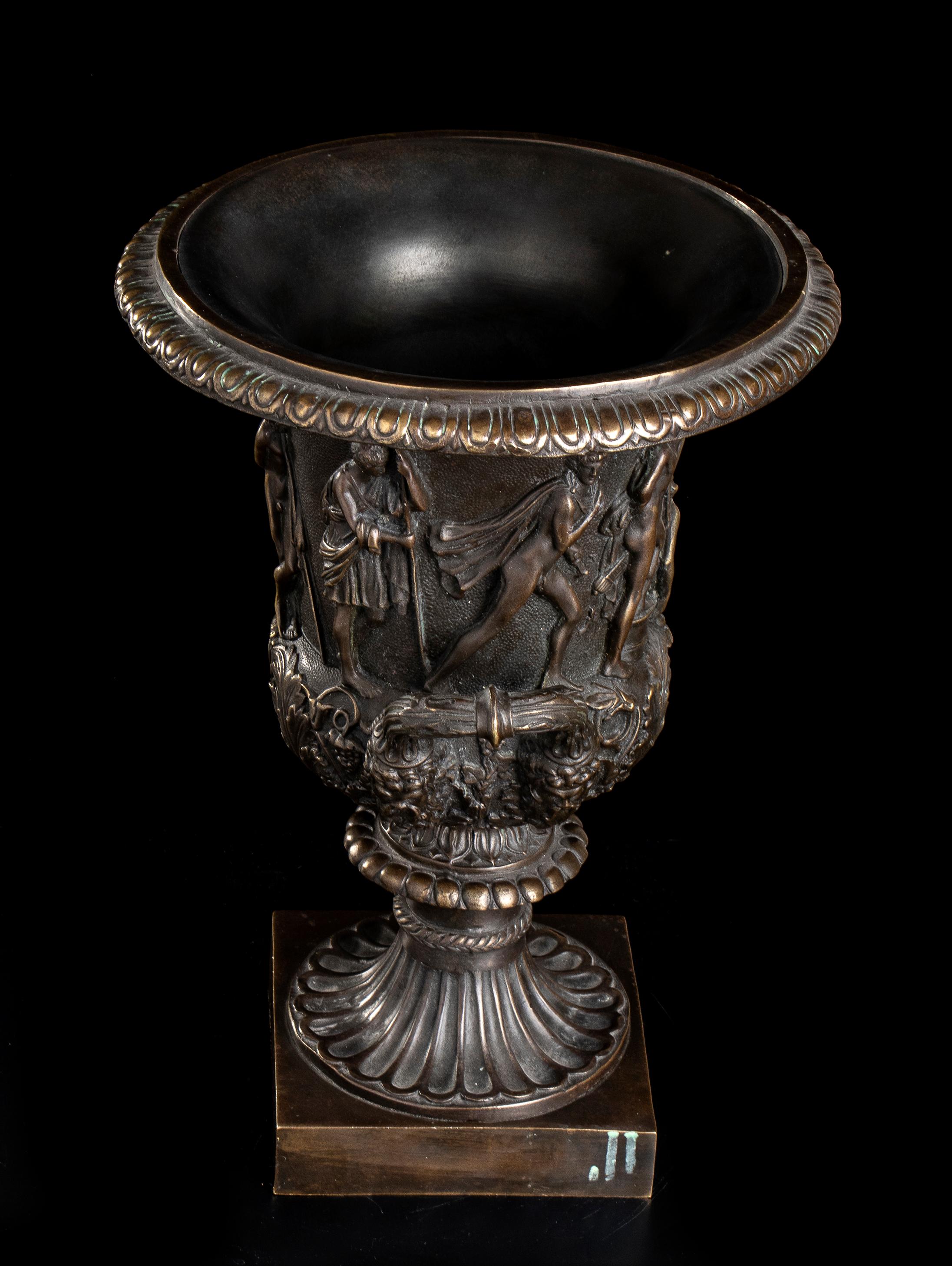 an impressive pair of grand tour chiseled bronze vases after the original and famous Medici Vase. The Medici Vase is a monumental marble bell-shaped krater sculpted in Athens in the second half of the 1st century AD as a garden ornament for the