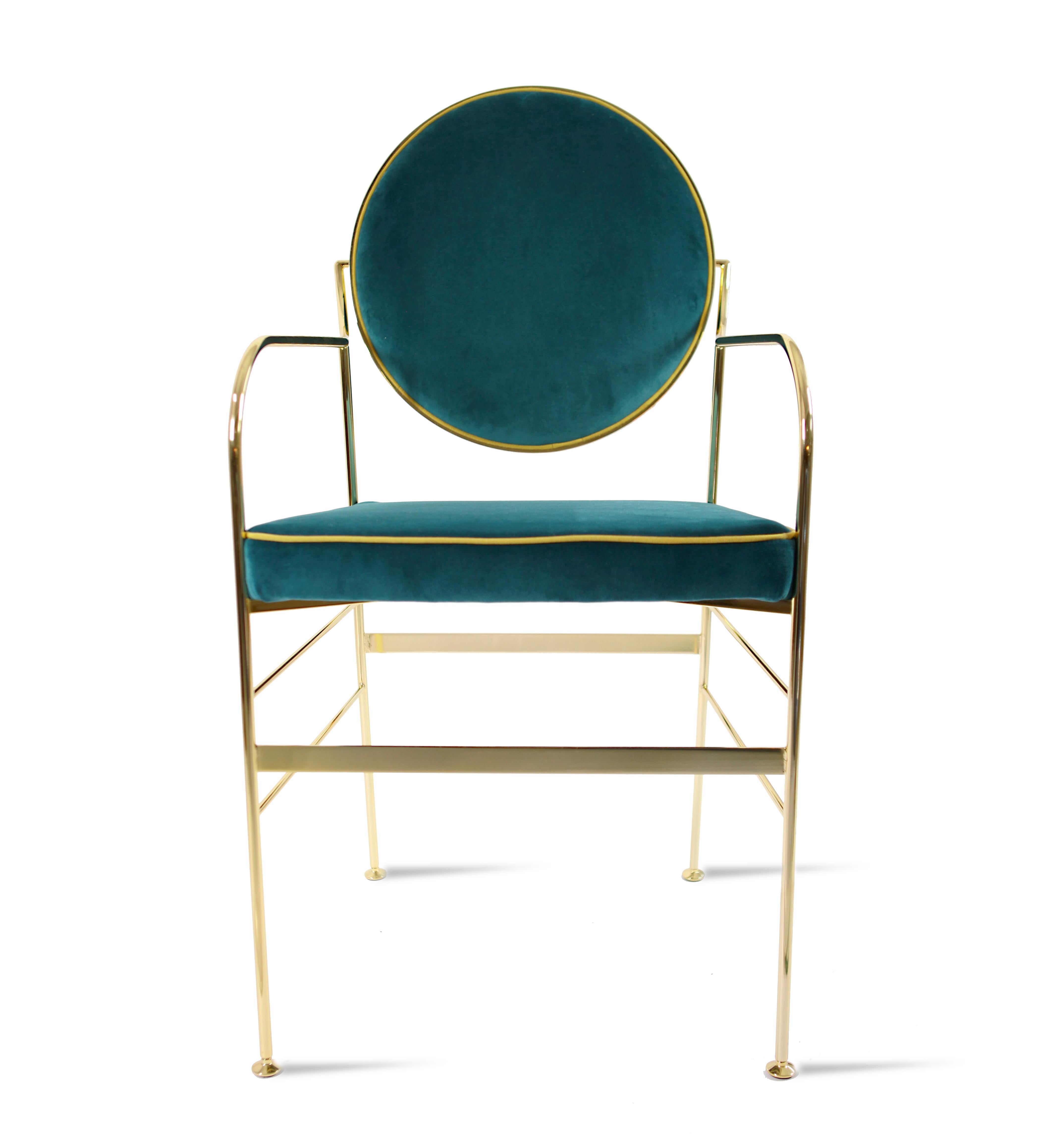 This striking chair has an iron structure covered with a 24-karat gold flash plating, and elegant galvanized brass feet. The back cushions (which move to achieve the perfect orientation) and the seat are covered in cotton velvet available in a range