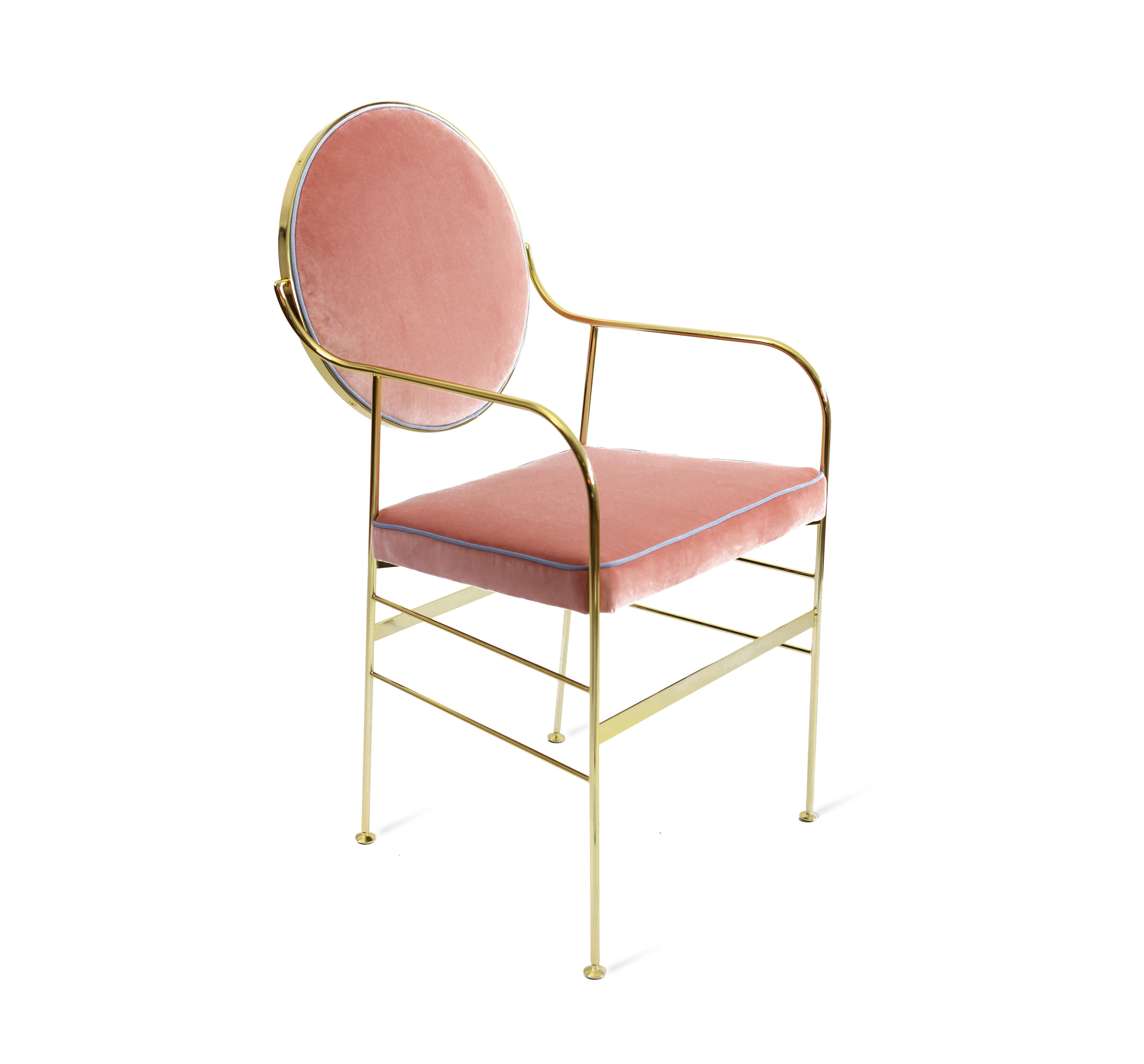 This striking chair has an iron structure covered with a 24-karat gold flash plating, and elegant galvanized brass feet. The back cushions (which move to achieve the perfect orientation) and the seat are covered in cotton velvet available in a range