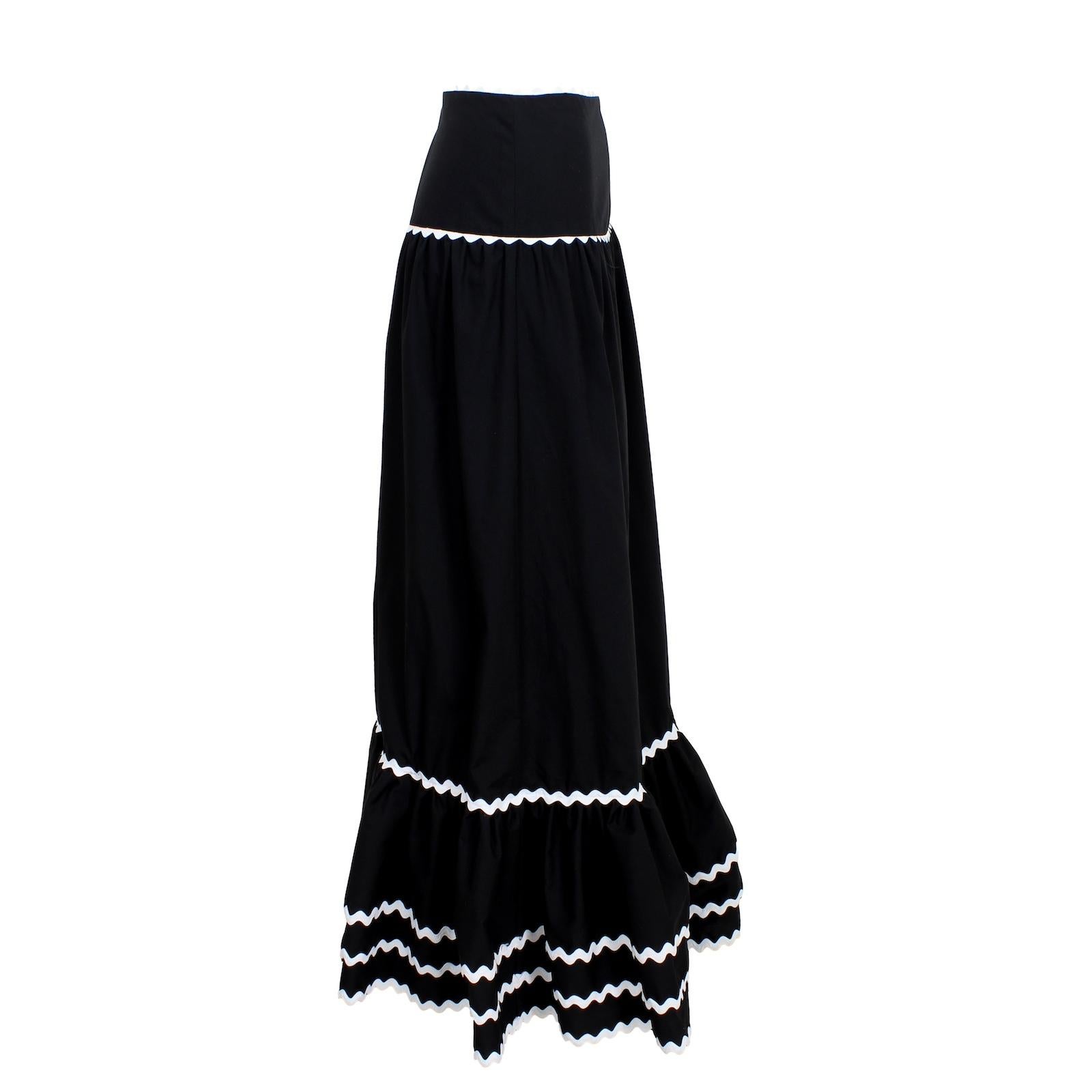 This Luisa Spagnoli Black a line Long Skirt is a vintage must-have. Made from lightweight cotton, this skirt features elegant ruffles and intricate embroidery, making it a truly unique piece. Perfect for a vintage-inspired look, this skirt adds a