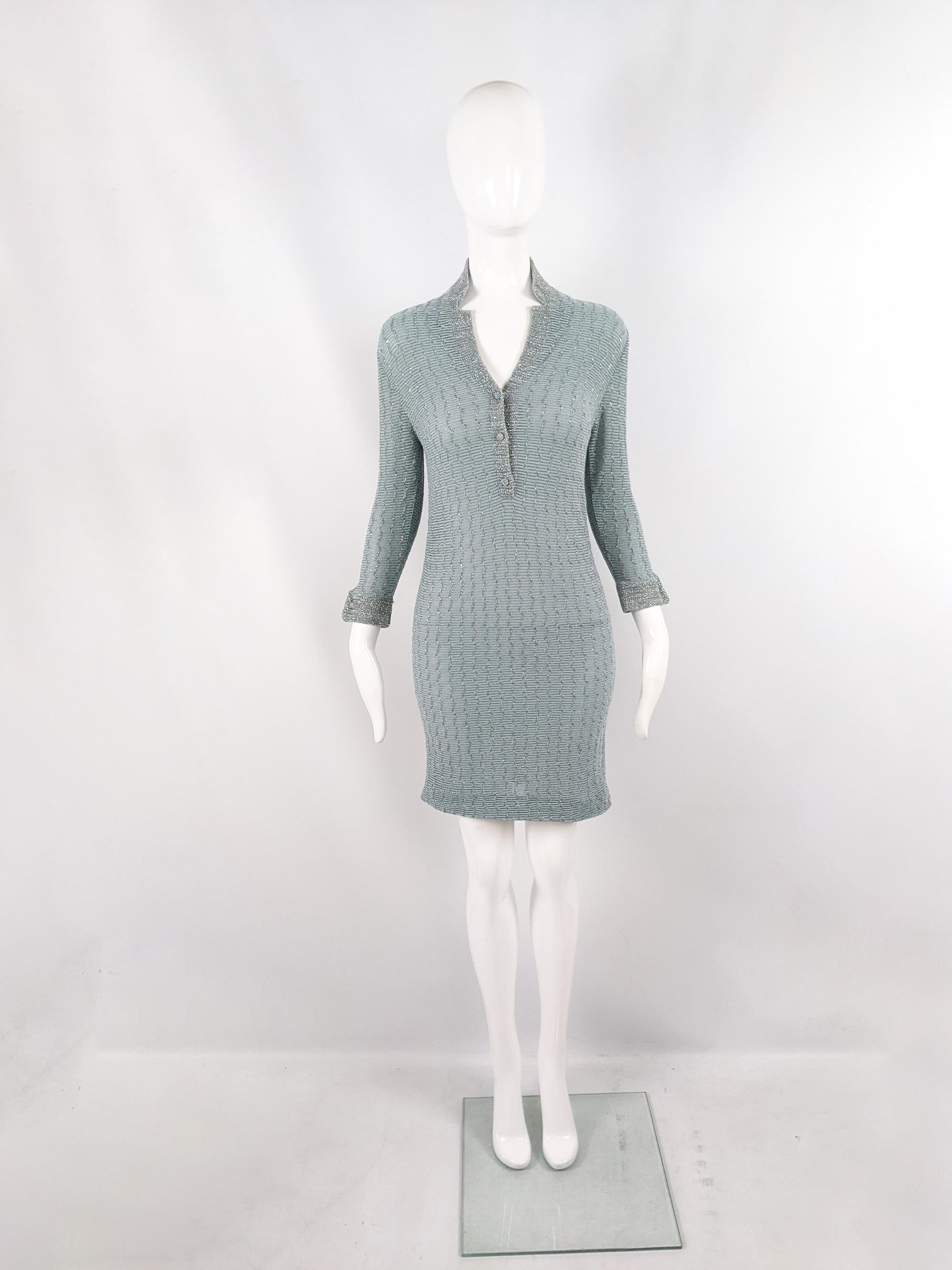 A fabulous and rare vintage womens mini dress from the 60s by luxury Italian fashion designer, Luisa Spagnoli. In a duck egg / pastel blue knit fabric with a silver lurex metallic thread running throughout adding a luxurious touch. It has bracelet