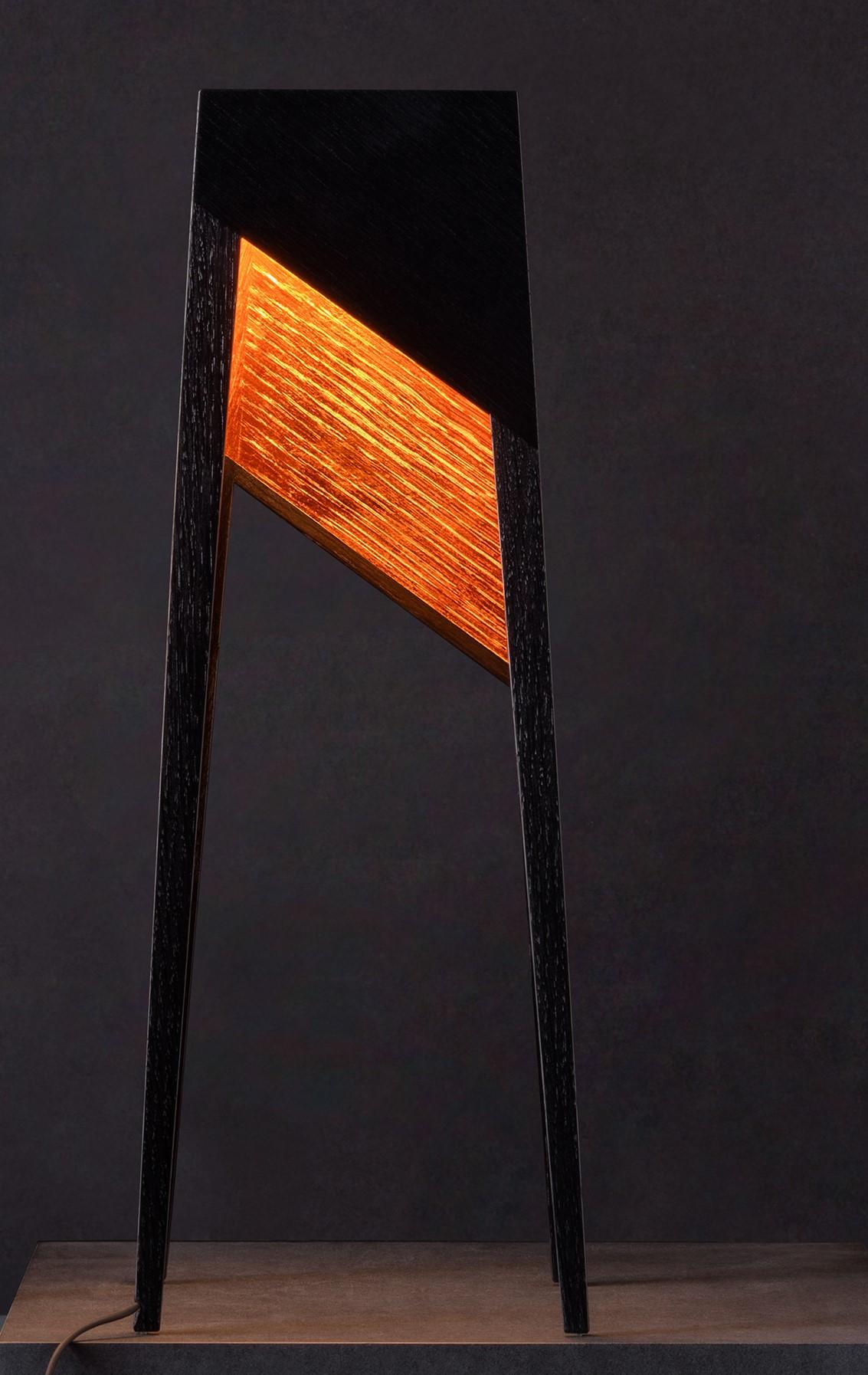 Luise LTD baby floor lamp by Matthias Scherzinger
Limited Edition of 2
Dimensions: H 46.5 x 18 cm
Materials: solid wood - oak black stained hard wax
Inside Surface: copper leaf

All our lamps can be wired according to each country. If sold to