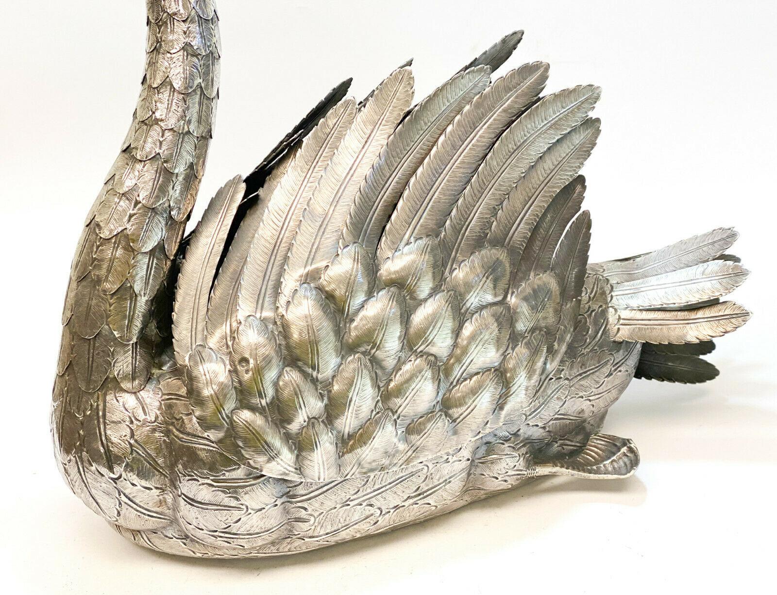 Luiz & David Ferreira Porto 833 silver articulated centerpiece swan bowl jardinière. Intricate hand chased feathers throughout the figural swan. An articulated neck and moveable wings. Marked David Ferreira and 