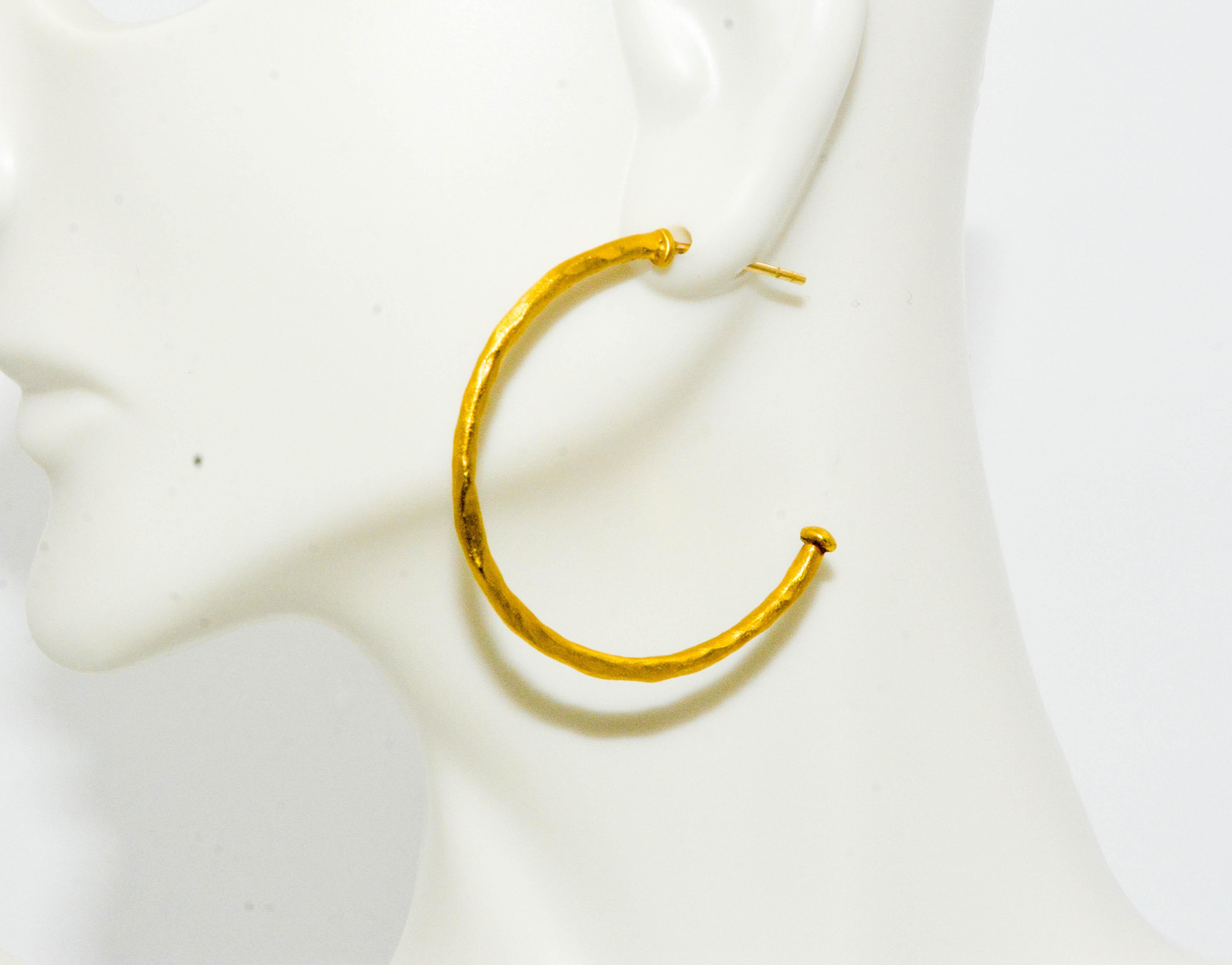 Designed with you in mind, these earrings blend style, terrific comfort and outstanding value. Designer Luka Behar 24 karat yellow gold large hoop earrings. Feather light and stylish in irresistible 24 karat gold!