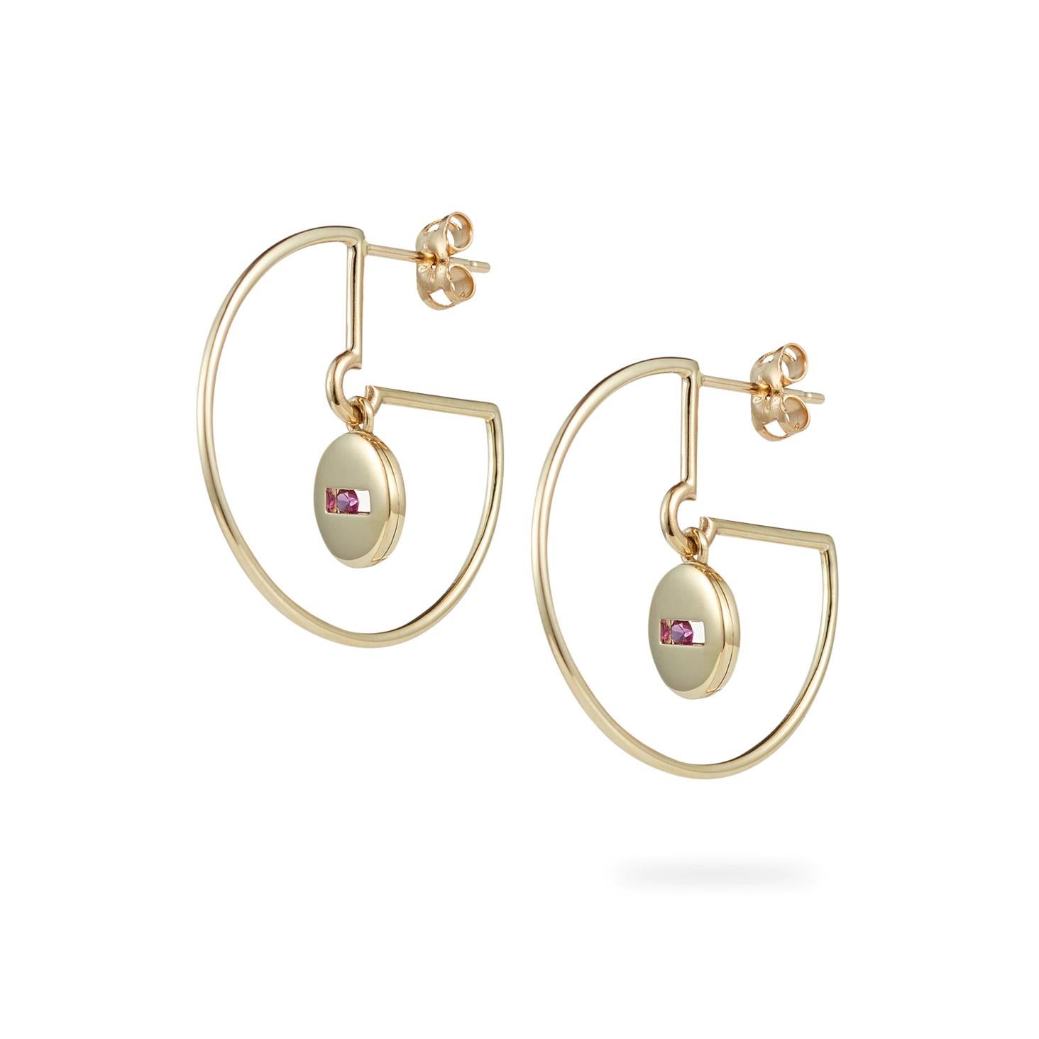 From the ROCK Collection. Each earring features the rolling rock elements hanging freely from the centre of each hoop, set with pink sapphires that move freely within their settings.

14ct yellow gold (nickel free)
Hoops measure 27mm across
Made