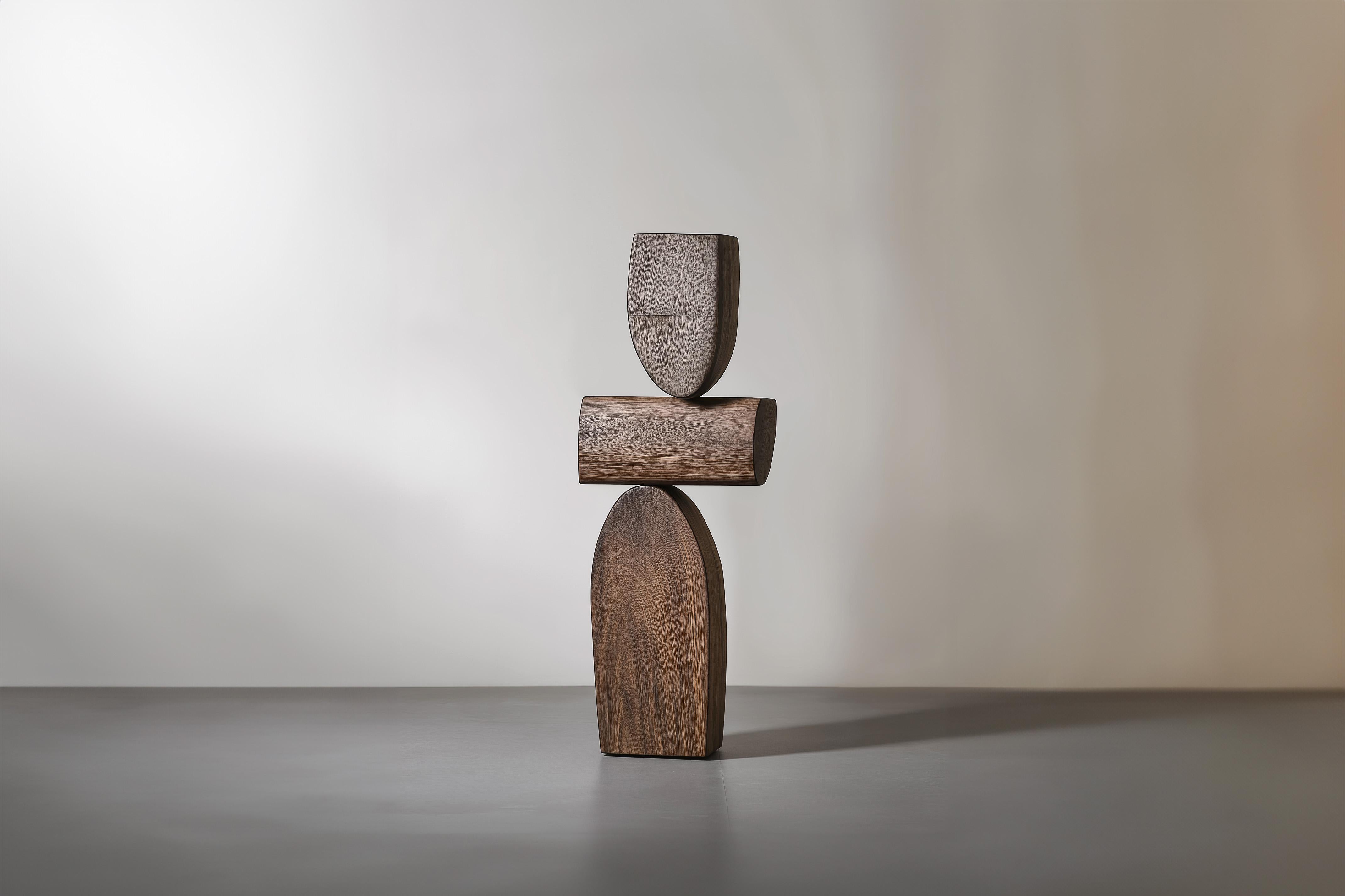 Lull No22 Minimalist Wooden Sculpture by Joel Escalona – A Decorative Object

———
Balance and tension are at the core of these sculptures. The interplay between the smooth, rounded forms and solid, angular bases creates a delicate equilibrium that