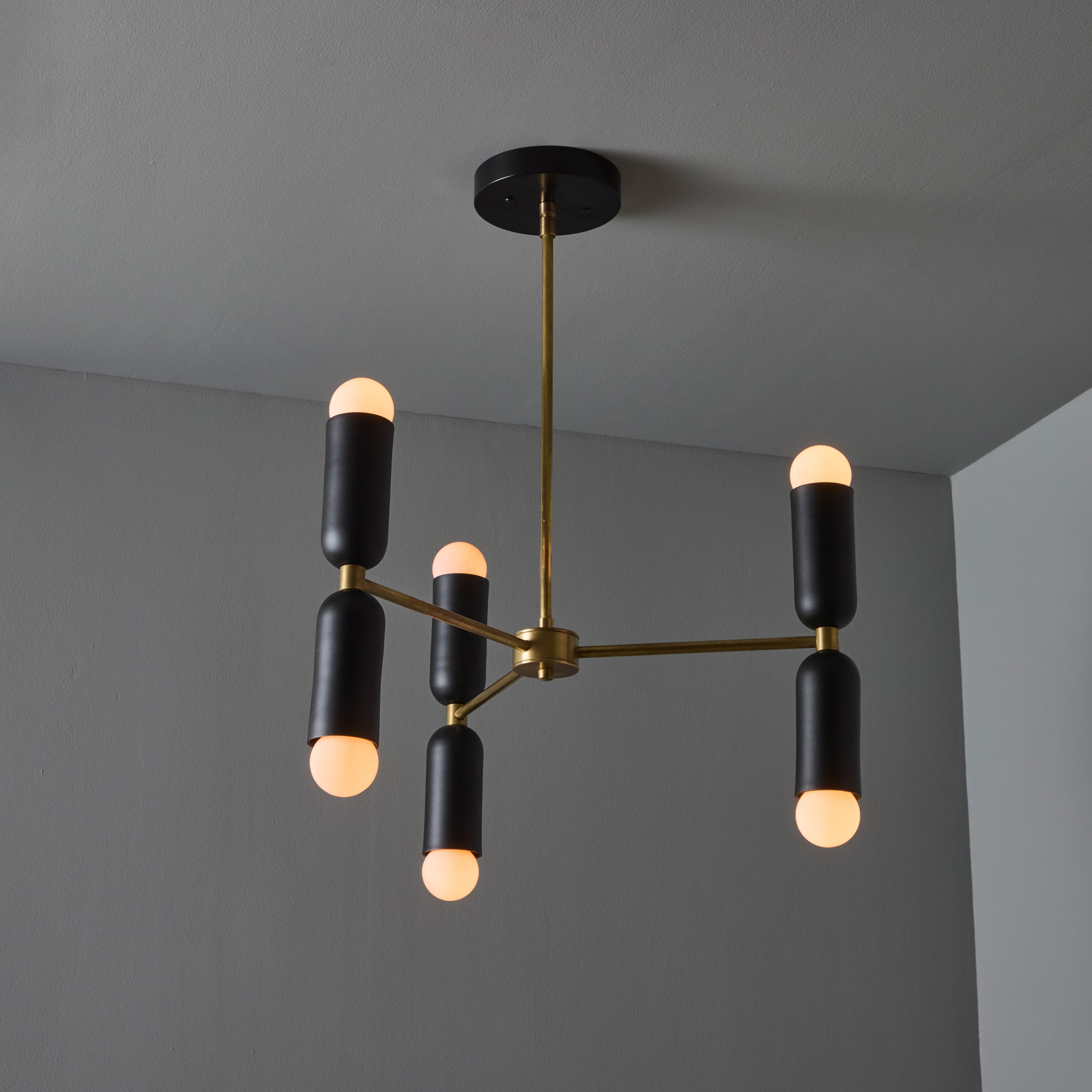 'Lulu' 3-arm chandelier in black & brass by Alvaro Benitez. Hand-fabricated by Los Angeles based designer and lighting professional Alvaro Benitez, these UL Listed and highly refined chandeliers are reminiscent of the iconic midcentury Italian