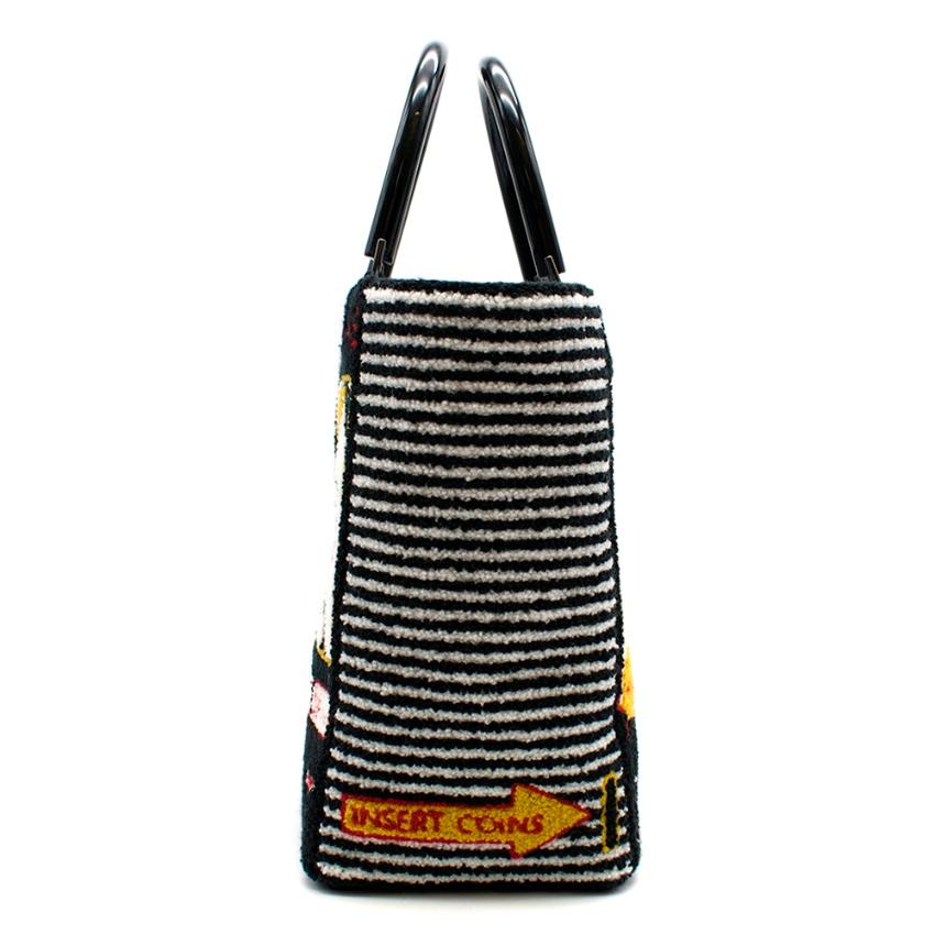 Lulu Guinness Jackpot Bibi Tote bag
- Textured Boucle Exterior
- Jackpot fruit machine print on front and back of the bag
- Horizontal stripe sides
- Vertical stripe print lining 
- Internal slip pocket
- Black acrylic handles
- Comes with