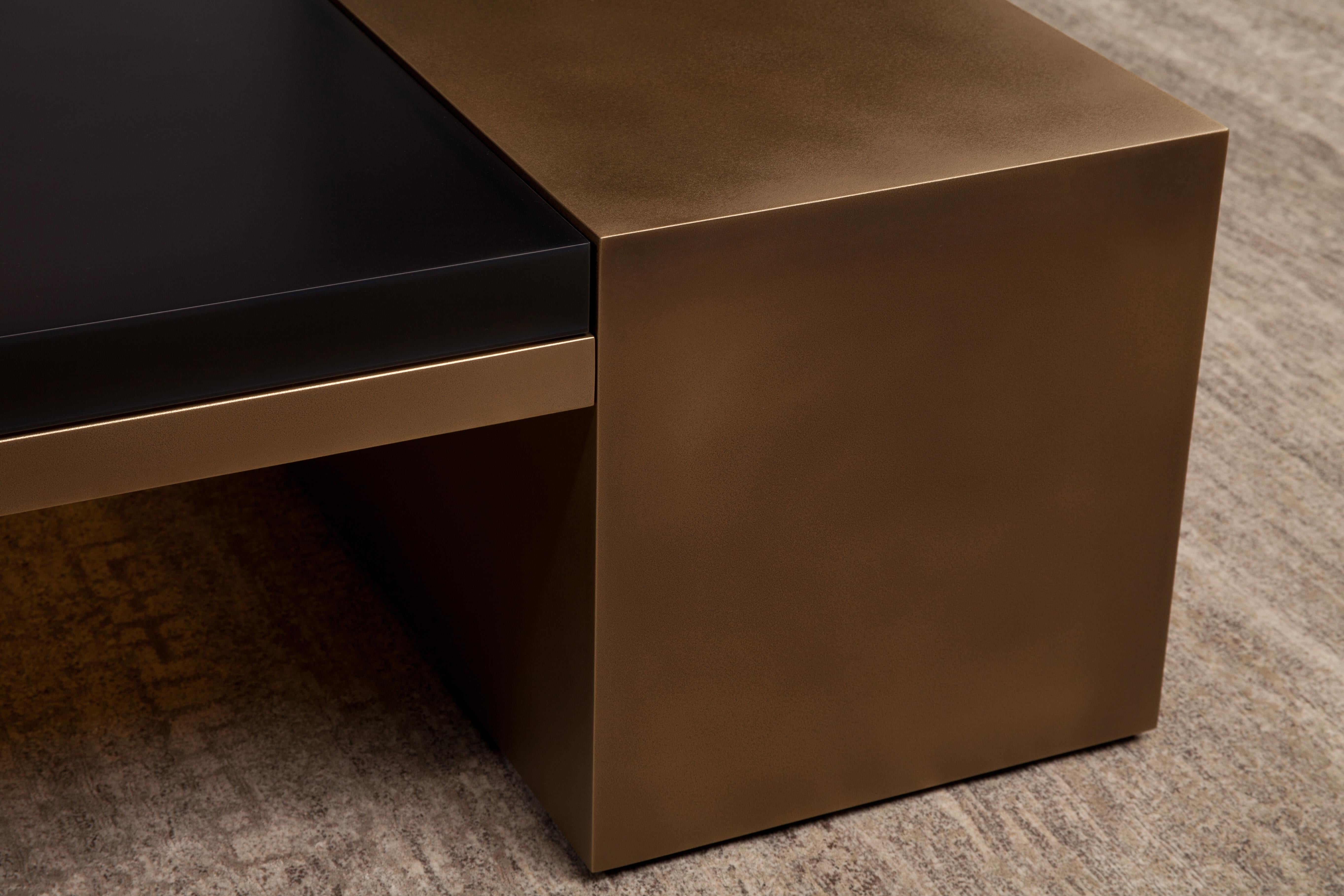 The LUMA Design Workshop block coffee table is the result of thoughtful design and expert craftsmanship. An earth color tinted translucent resin top sits between two bronze quartz bases.
 
Like all LUMA Furniture, this piece is made to order, and