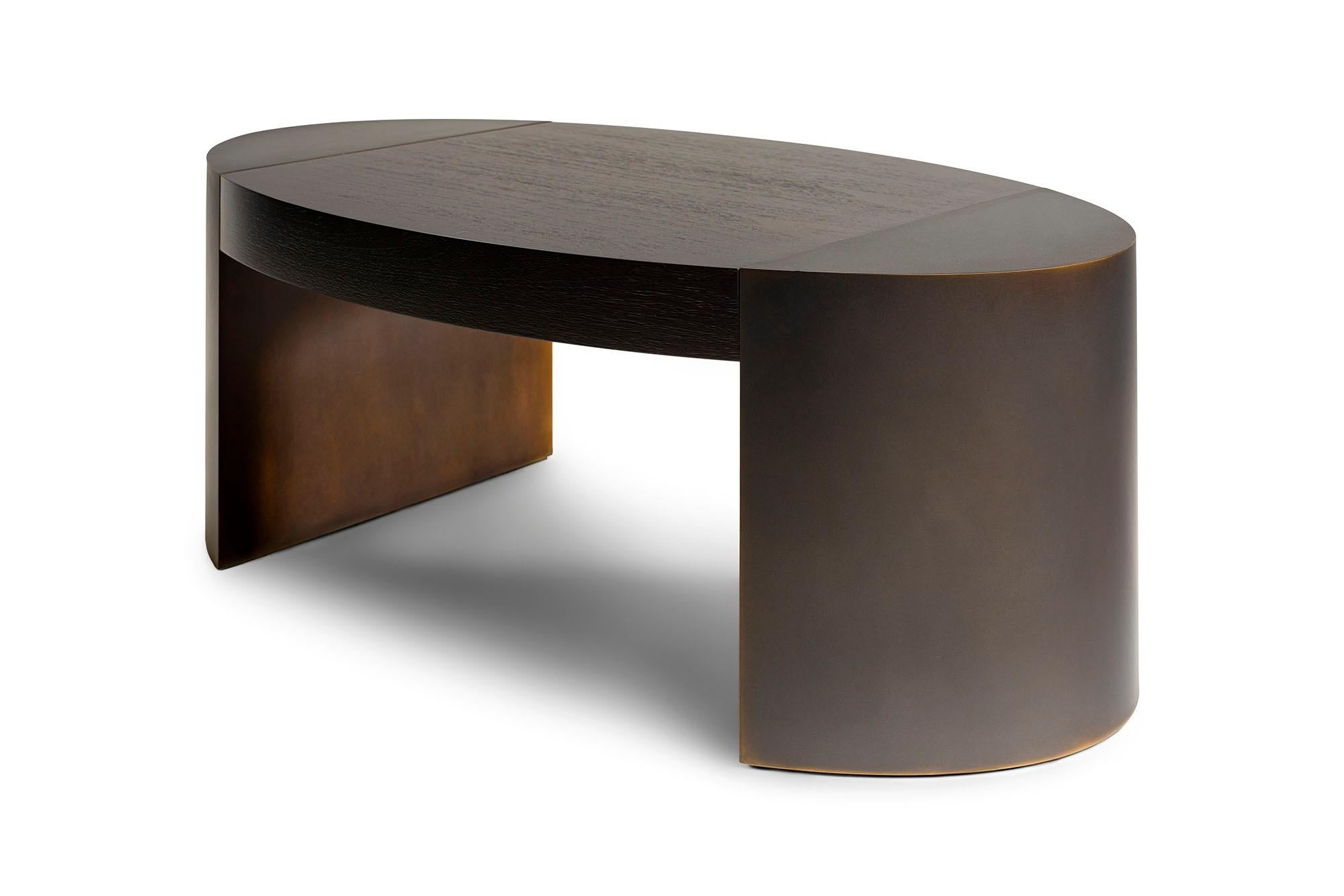 The LUMA Design Workshop Silo coffee table is the result of thoughtful design and expert craftsmanship. A Truffle Walnut top is held between two dark bronze finished ends to create the ellipse shape which gives this table its character.

Like all