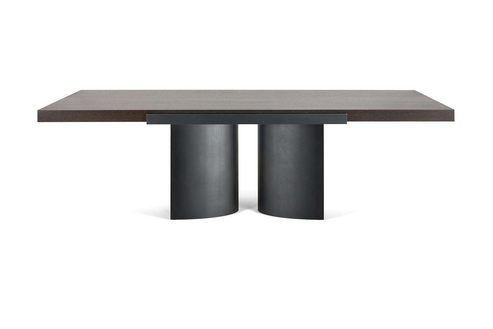 The LUMA design workshop silo grip dining table is the result of thoughtful design and expert craftsmanship. A large slab of fumed oak is gripped and supported by Antique steel bases.

Like all LUMA furniture, this piece is made to order, and can