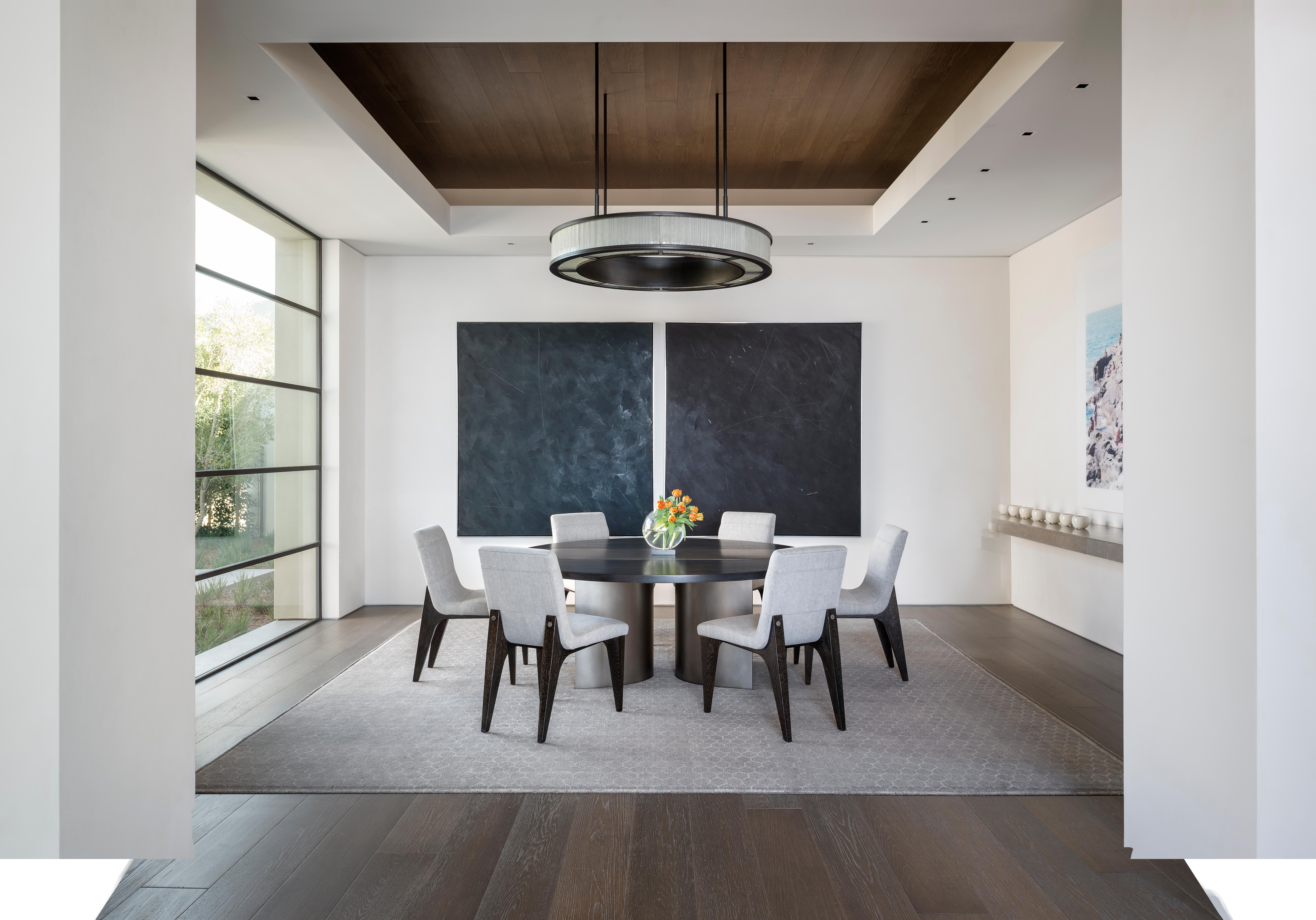 The LUMA Design Workshop Silo round dining table is the result of thoughtful design and expert craftsmanship. Nickel Plated curved metal bases support a round Truffle Oak top with a Nickel Plated center strap detail.

Like all LUMA Furniture, this