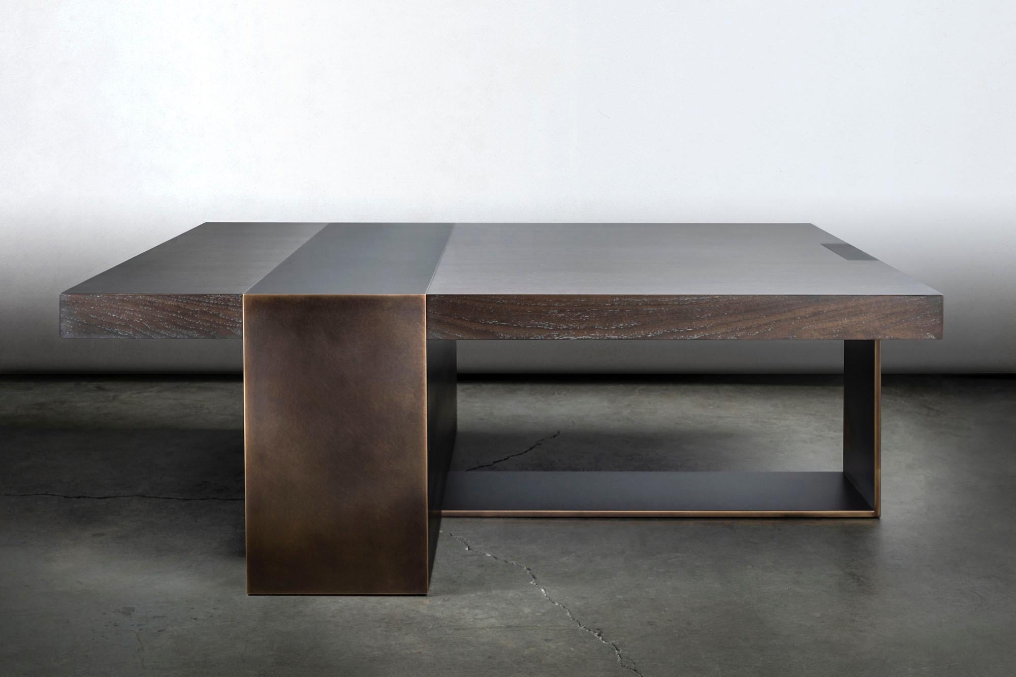 The LUMA design workshop strap coffee table is the result of thoughtful design and expert craftsmanship. The fumed oakwood top is held up by a dark bronze finished metal base.

Like all LUMA furniture, this piece is made to order, and can be