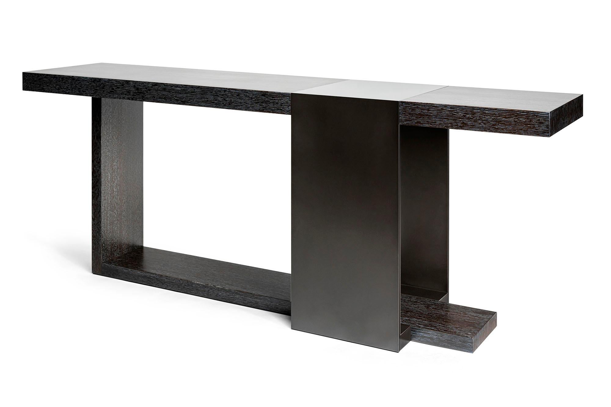 The LUMA design workshop strap console table is the result of thoughtful design and expert craftsmanship. The top and leg are made of wood with a char oak finish, while the strap base is made of metal which has a charcoal powder coat finish.

Like