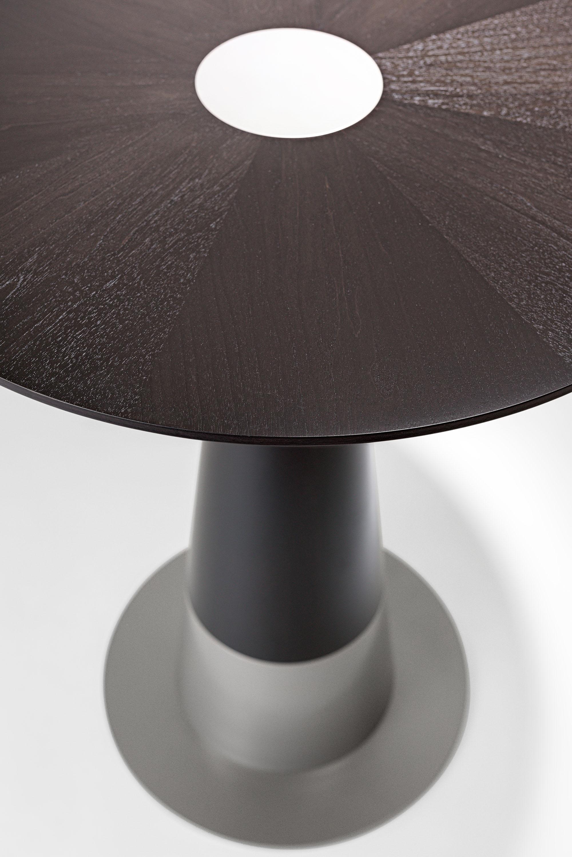 The LUMA design workshop silo bar pedestal table is the result of thoughtful design and expert craftsmanship. Clean angled round wood, a spun steel base, and inlay give this piece its beautiful form. Truffle Walnut and Nickel Powder Coat finished